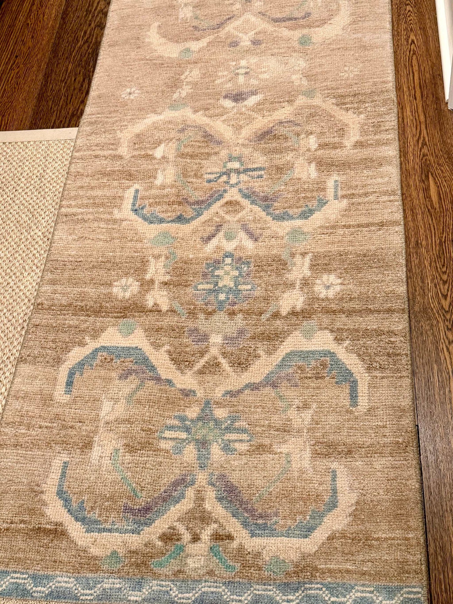 2’7”x6’4” shorter vintage runner rug with brown, cream, beige, and purple accents