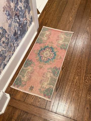 Small Turkish mat with bold pink-red and blue center design