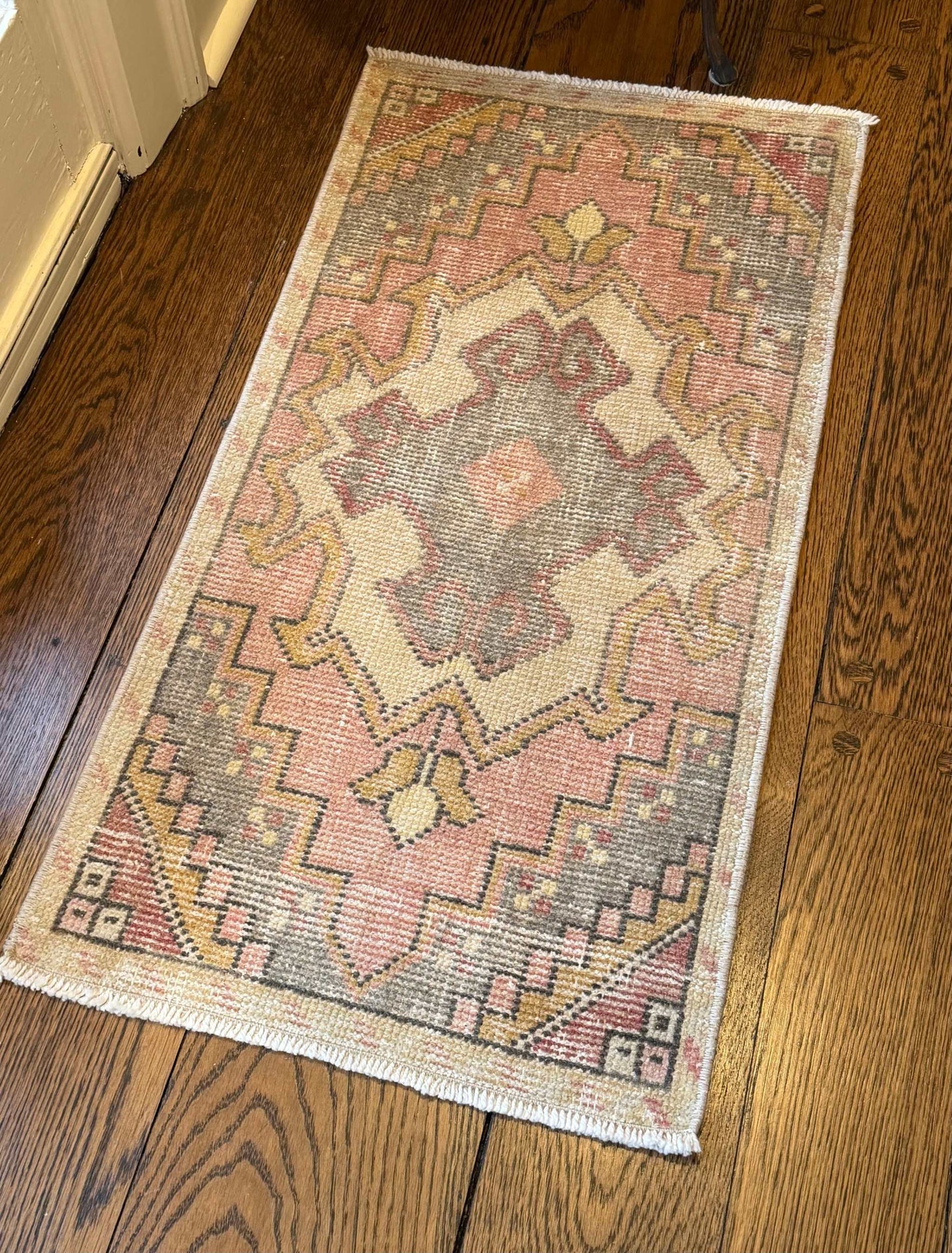 1’6”x3’1” Vintage Oushak Mat with pink, gray, gold, muted red, and cream colors