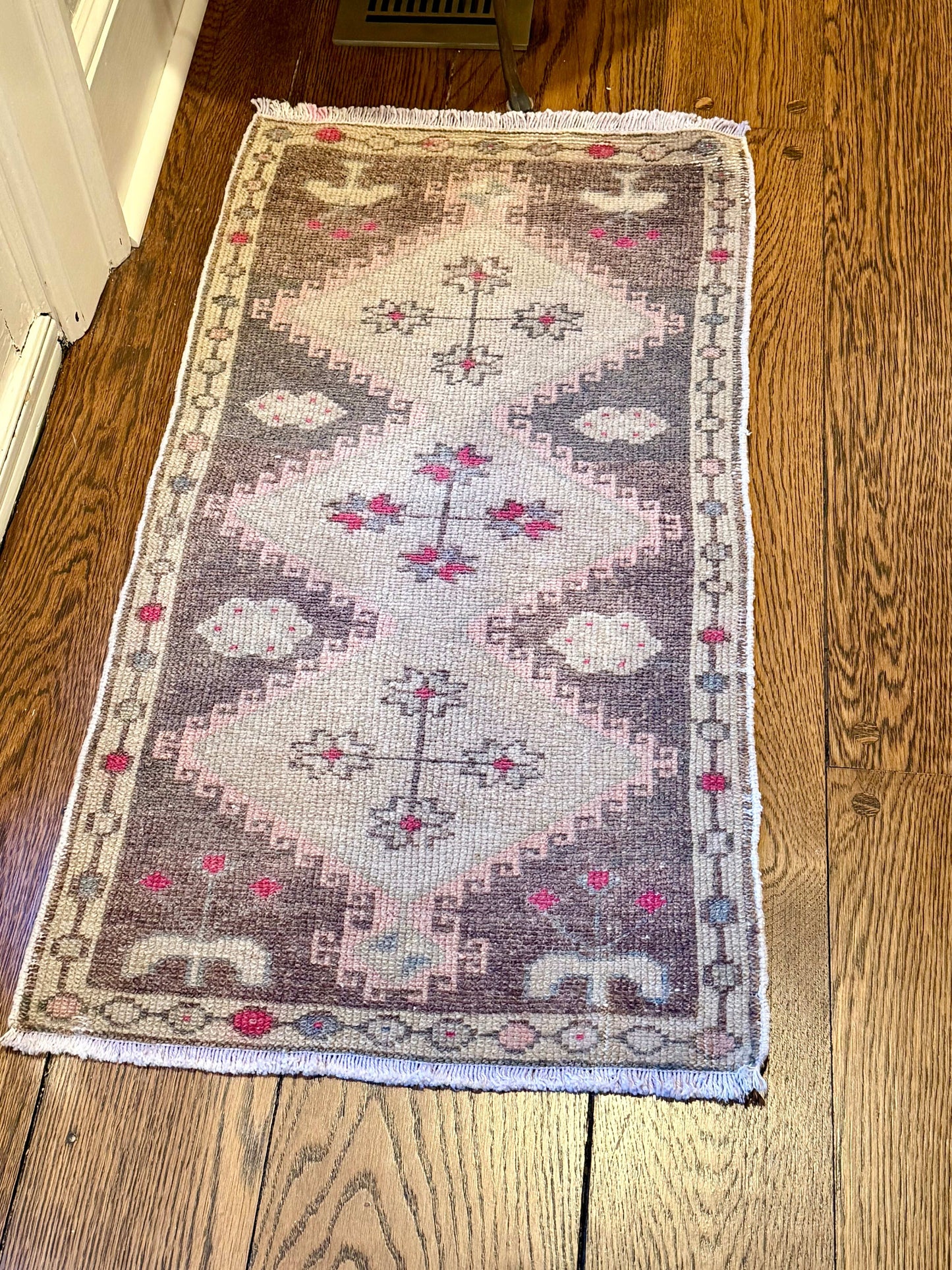 1’7”x3’2” Vintage Oushak mat with brown, beige, hot pink, pink, and blue colors
