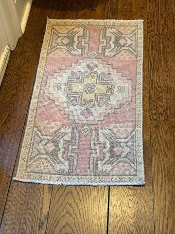 Small Turkish Rug with blush background and traditional design for entryway or hallway