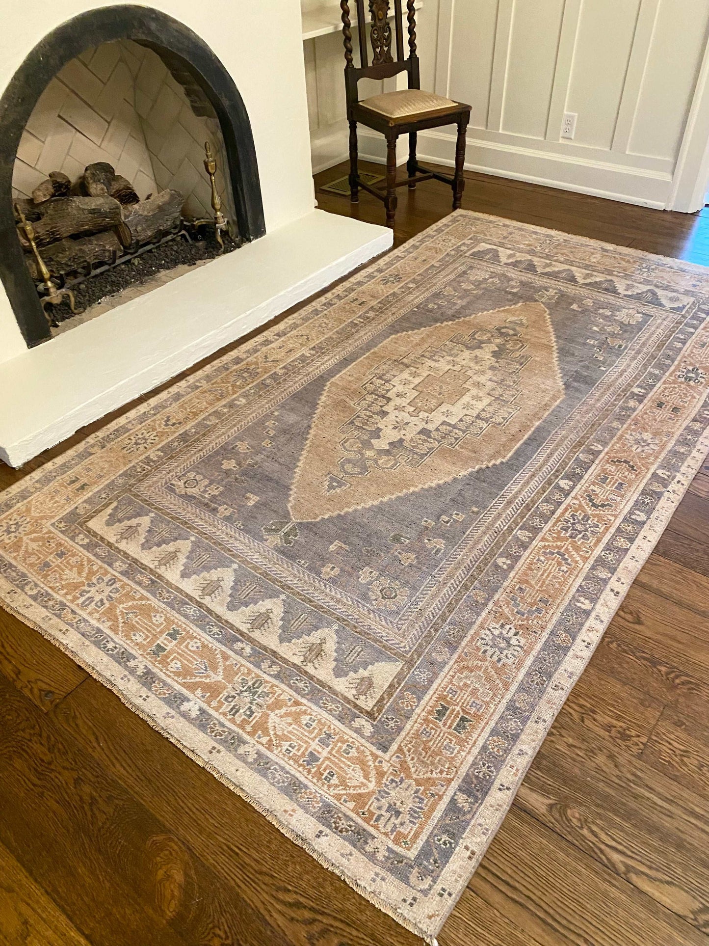 5’4”x9’5” Vintage Oushak area rug in beige, camel, blue, and cream.