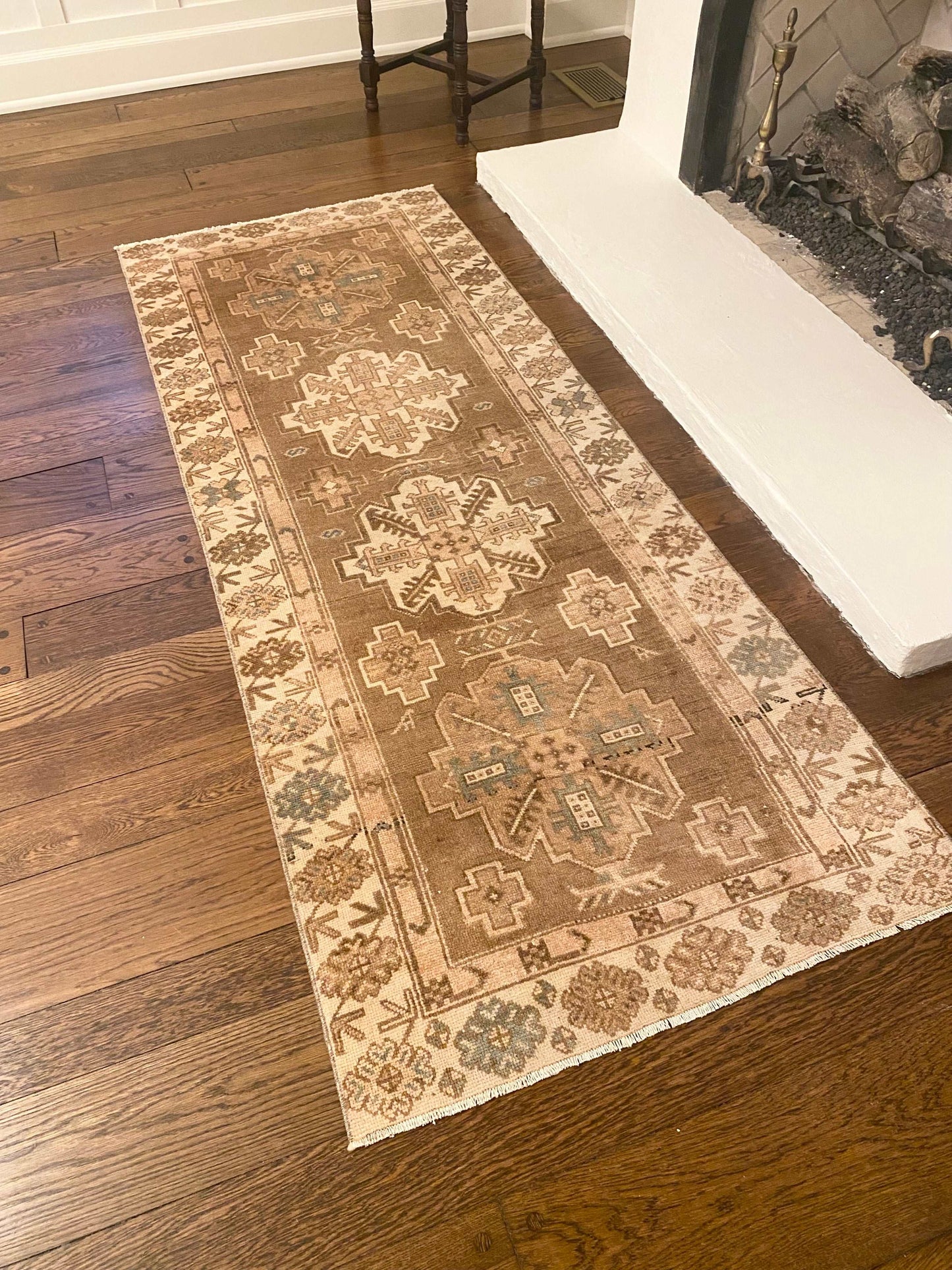 Vintage Oushak runner rug in brown, beige, cream, blue, and blush, measuring 3’0”x7’10”.