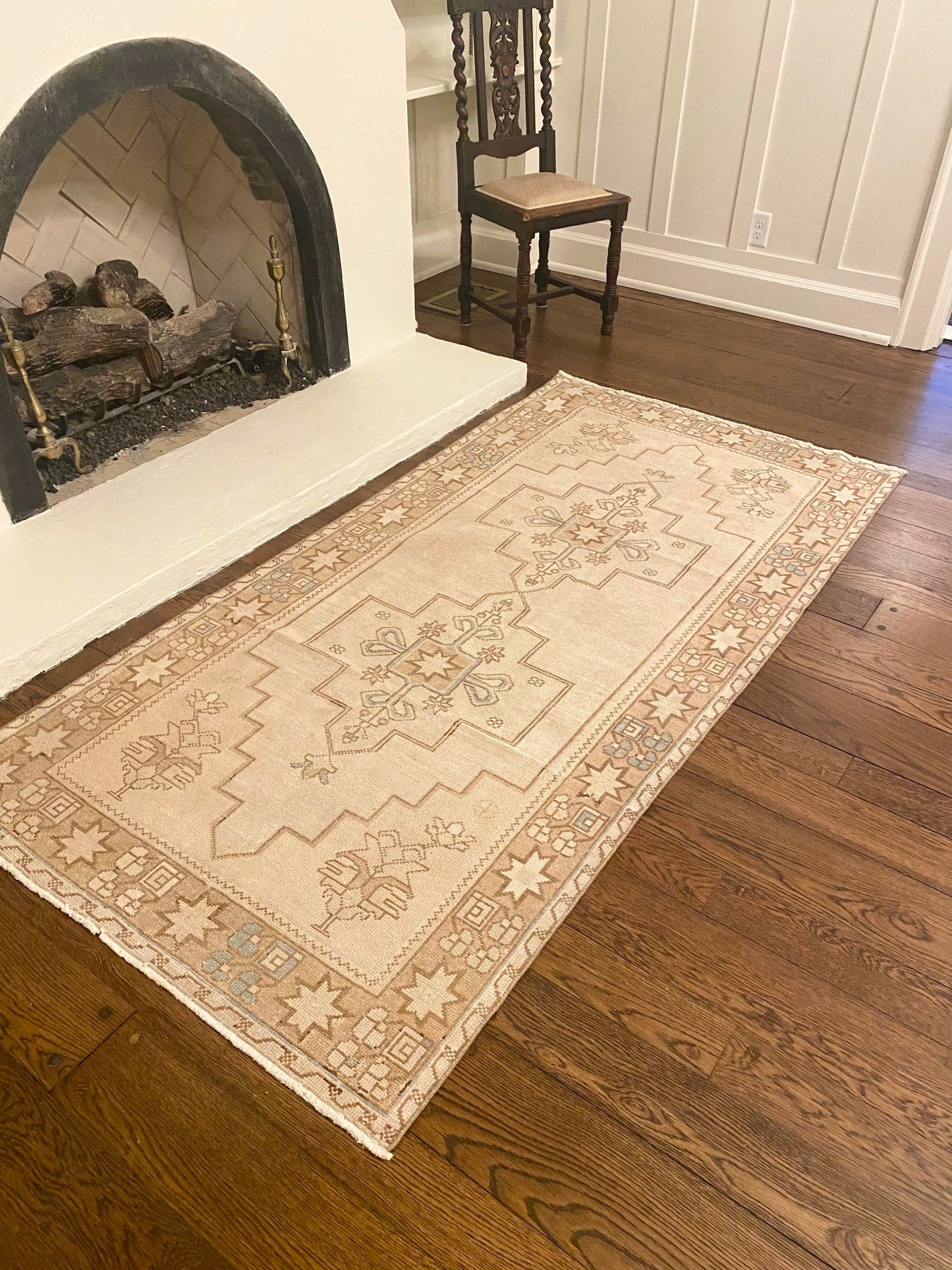 3’9”x7’9” vintage Oushak area rug with light beige, brown, cream, and blue pattern.