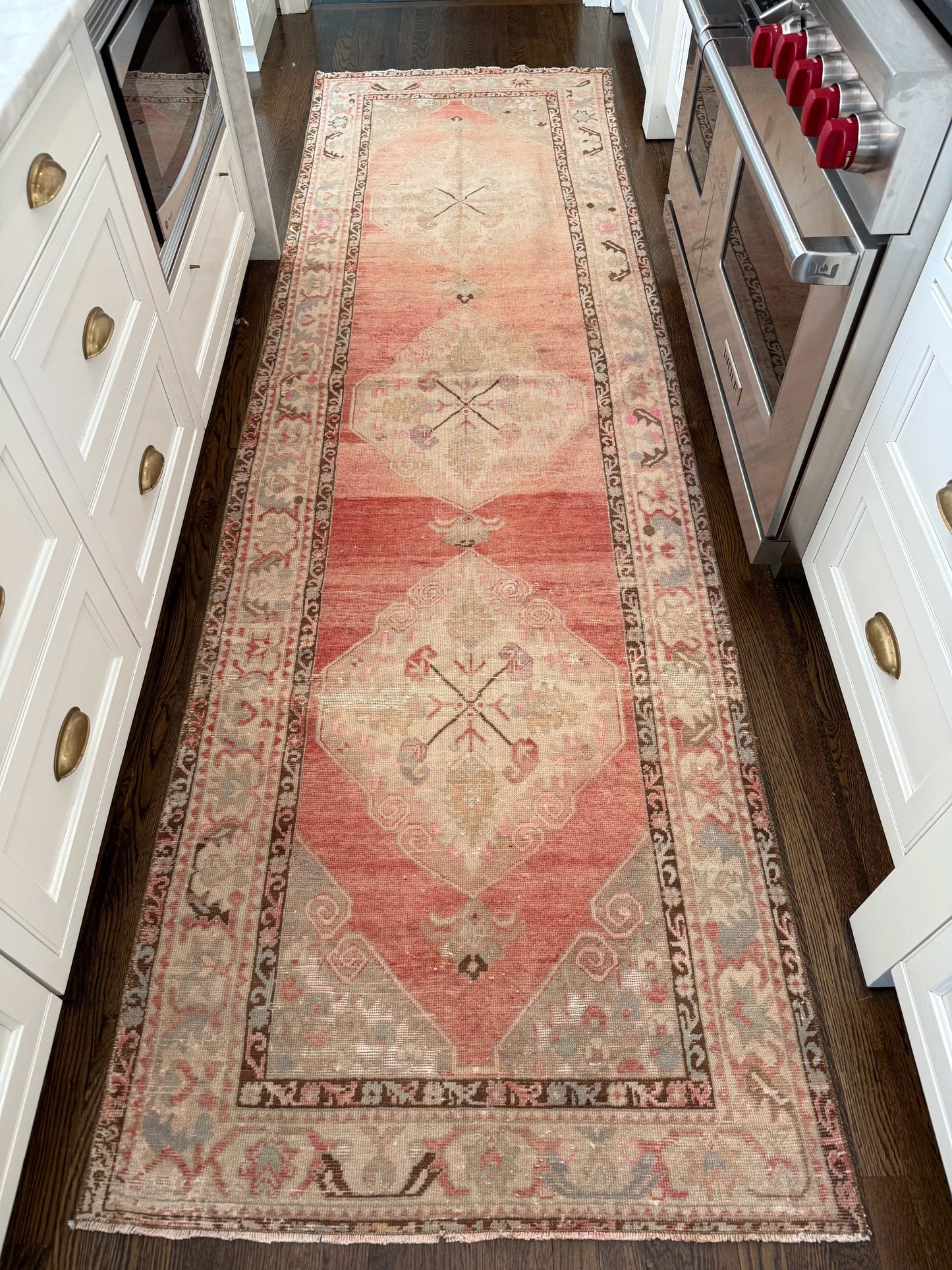 3’3” x 11’3” runner with blues, reds, browns, pinks, and greens.