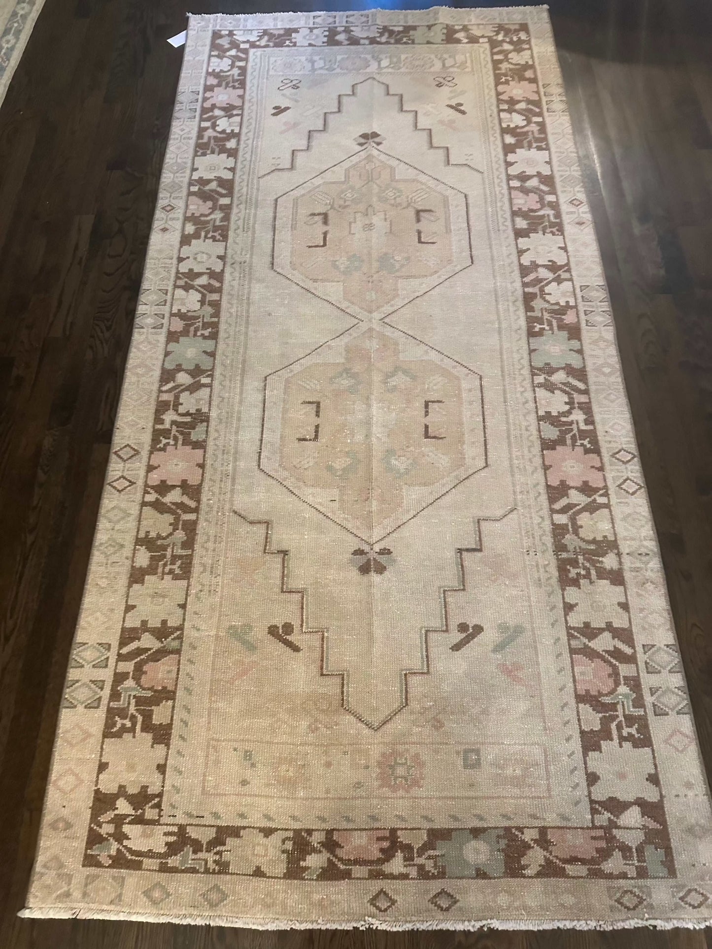 Vintage-style runner rug with geometric patterns, measuring 3'10" x 8'2".
