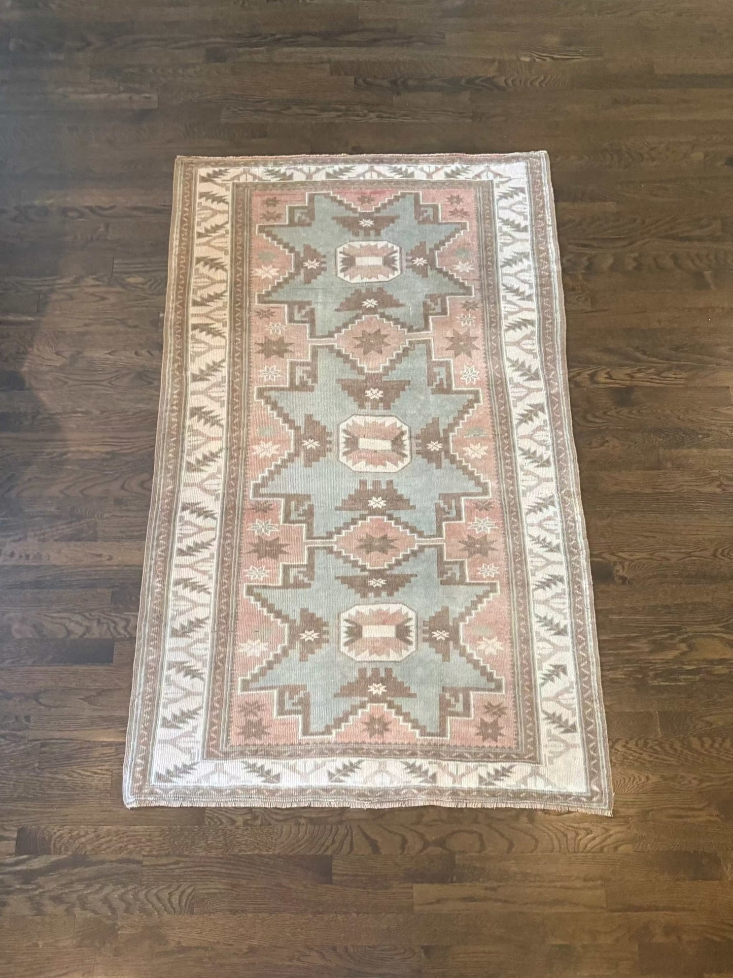 3’7” x 5’8” area rug with dusty blush, muted sage green, warm taupe, ivory, terracotta, and gray tones