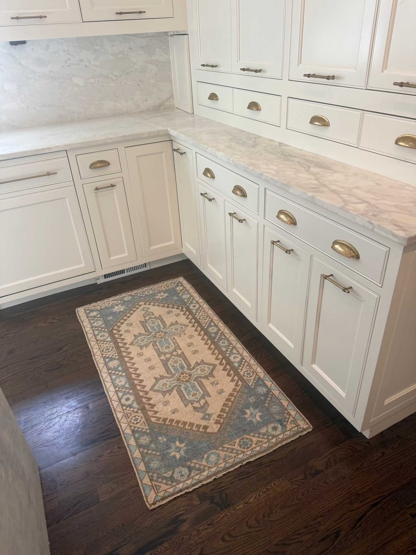 2’4” x 4’5” runner with blue and brown accents on beige background