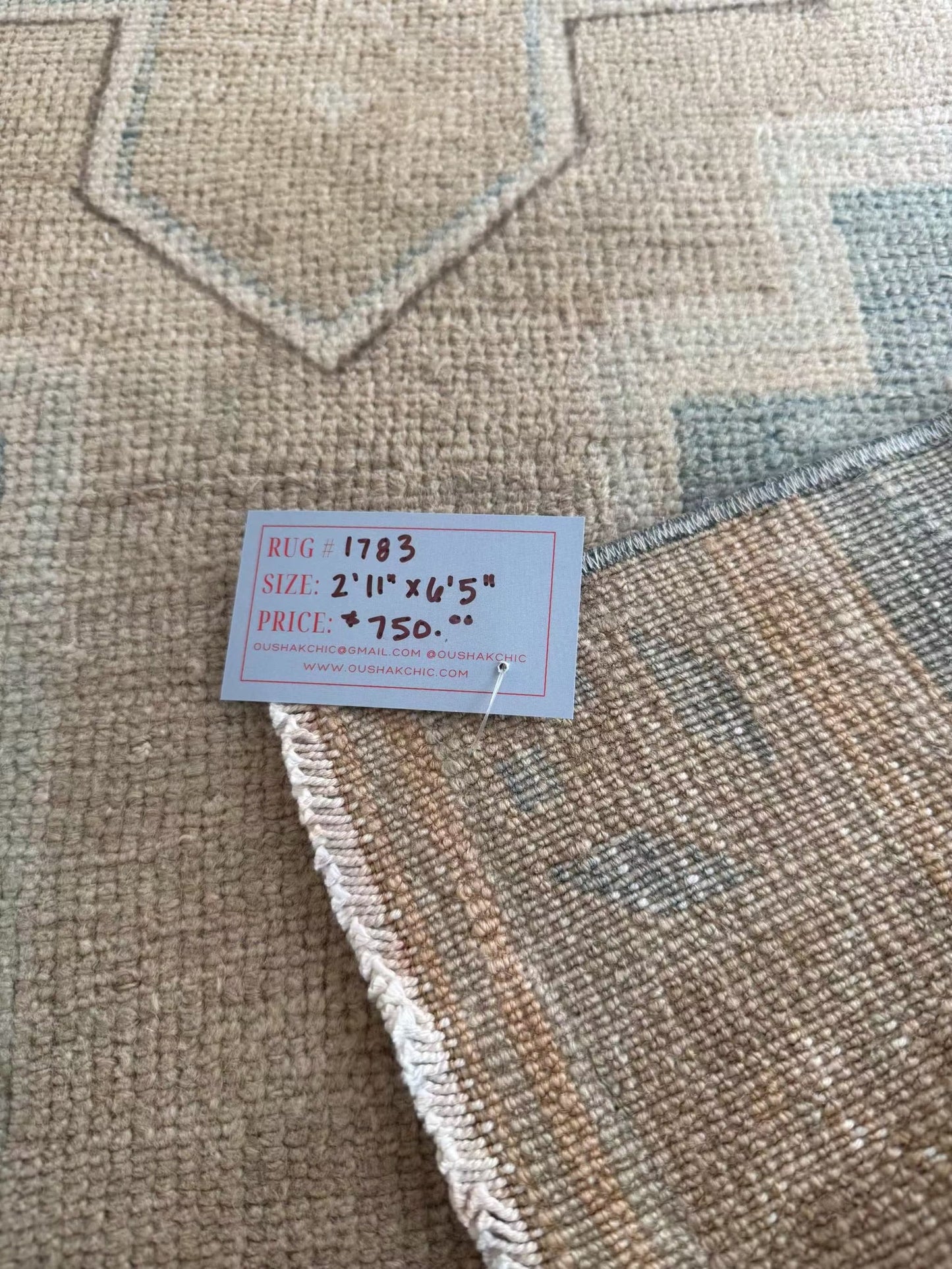 2’11” x 6’5” beige runner with stunning blues and brown accents
