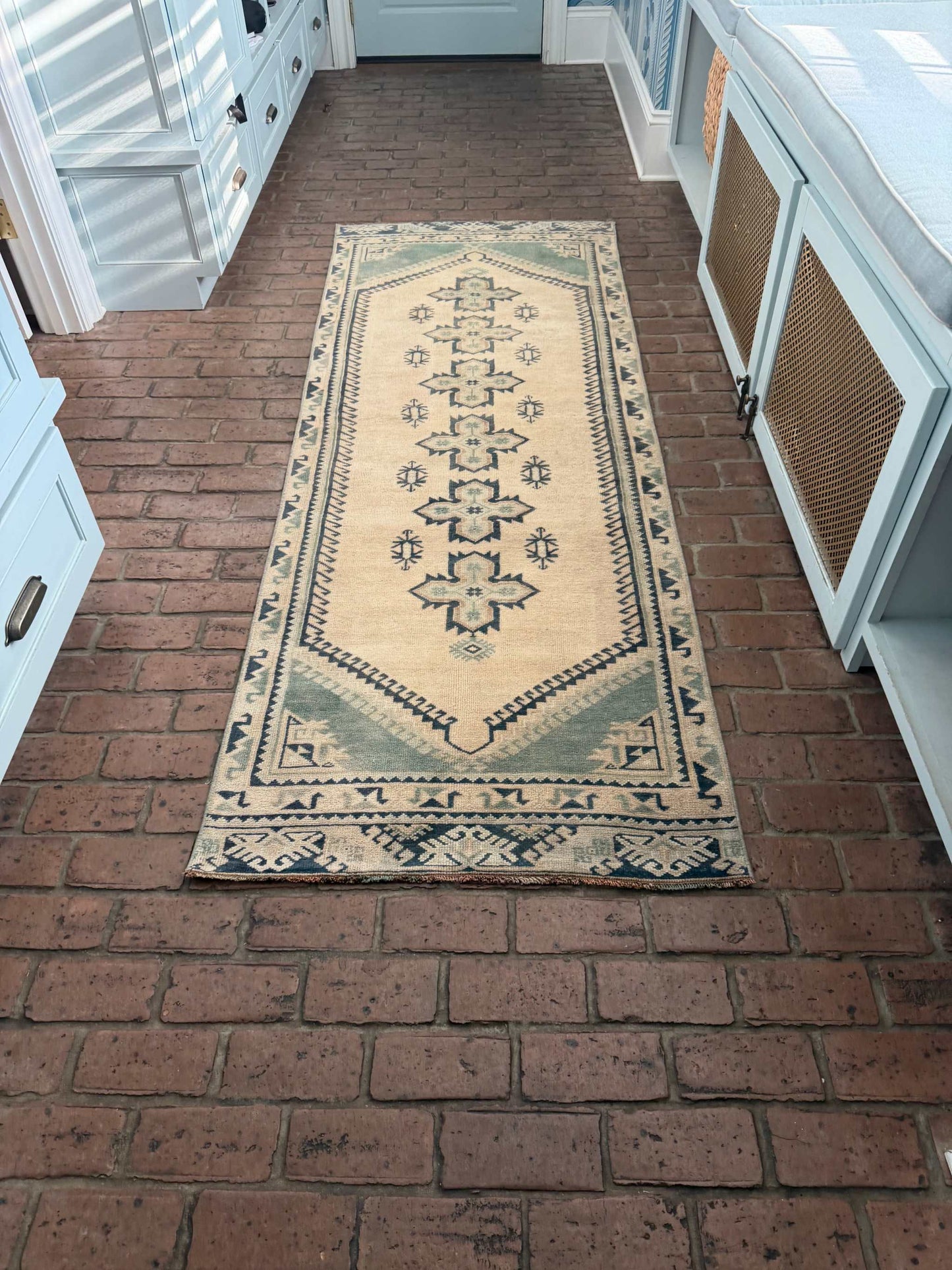 2'11" x 8'5" hand-knotted vintage runner with blue-green and beige cross center design