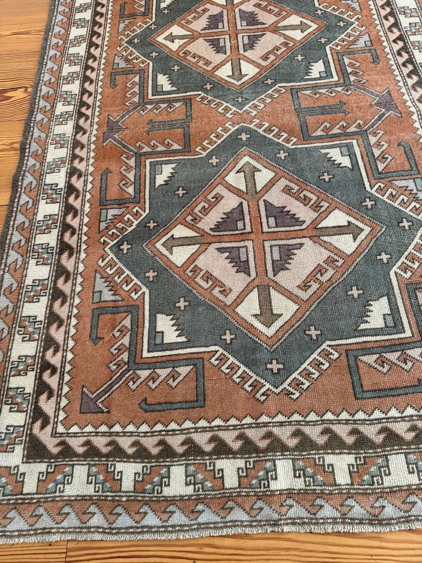 4' x 5'10" area rug with rust and gray double medallion design