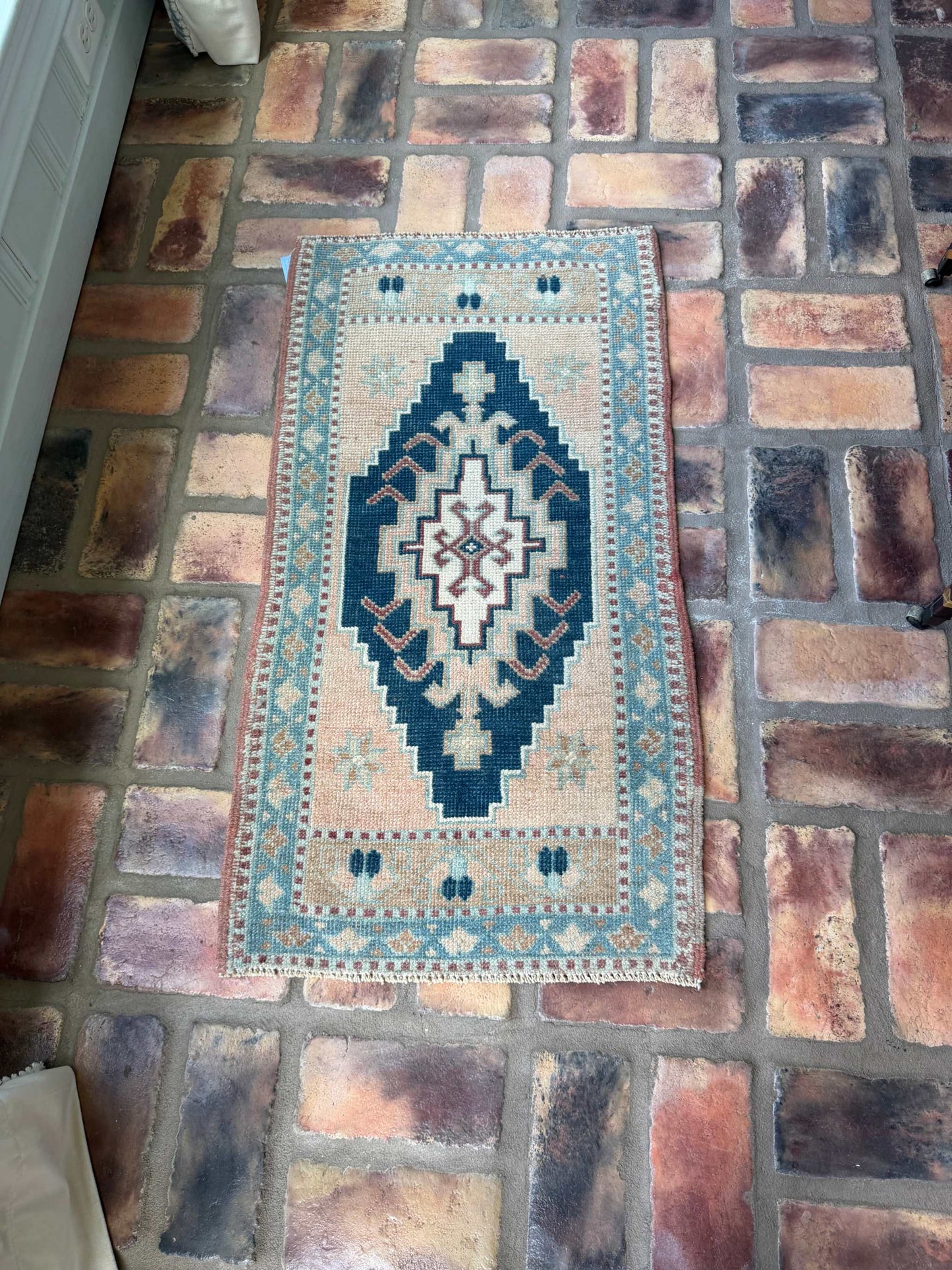 Small Turkish Rug 1'8" x 3'1" hand-knotted wool with navy, beige, and blue center medallion design
