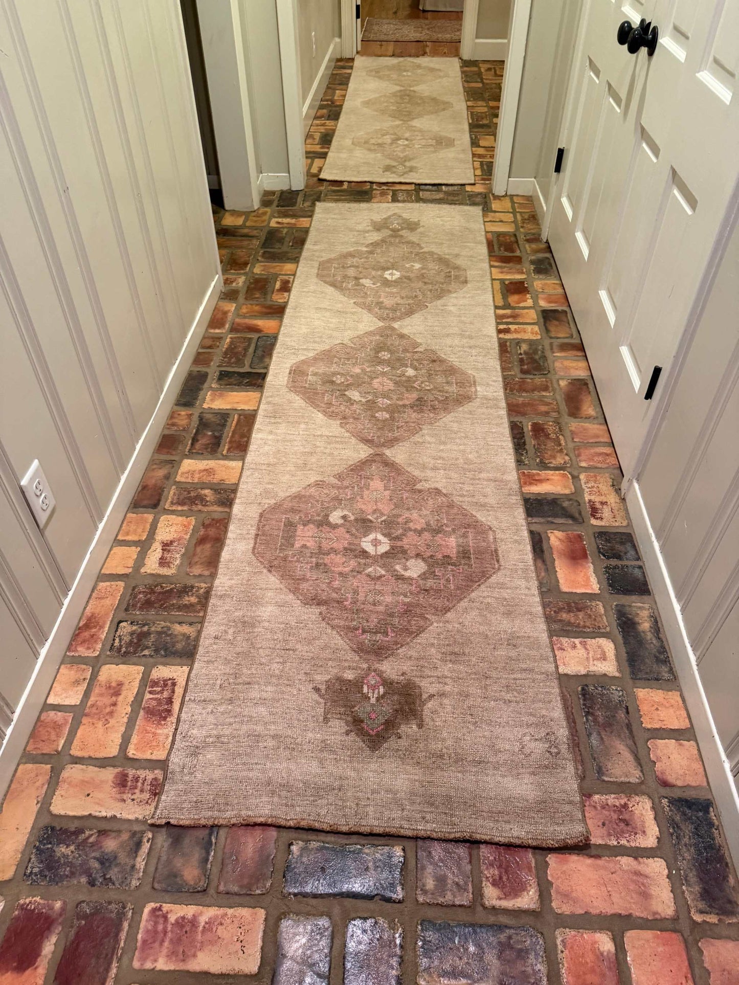 2'7" x 9'5" hand-knotted Turkish runner with brown and beige background and pink medallion center designs
