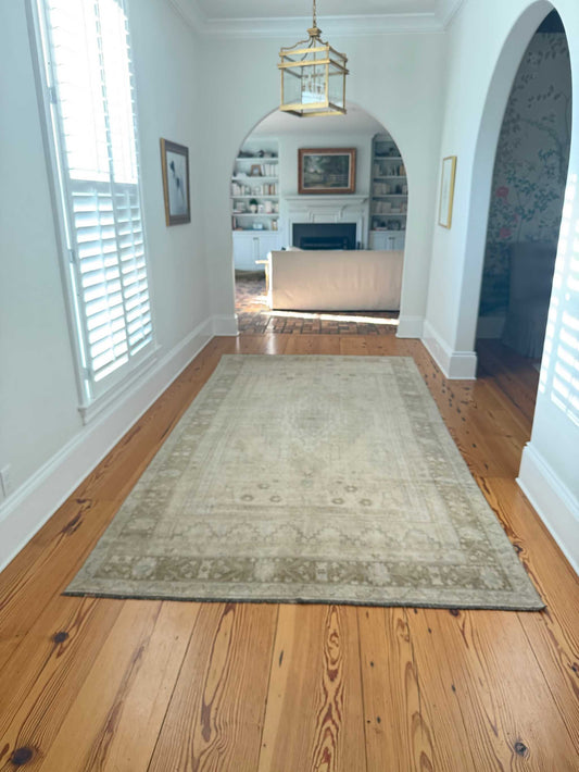 Vintage Oushak rug styled in a living room.