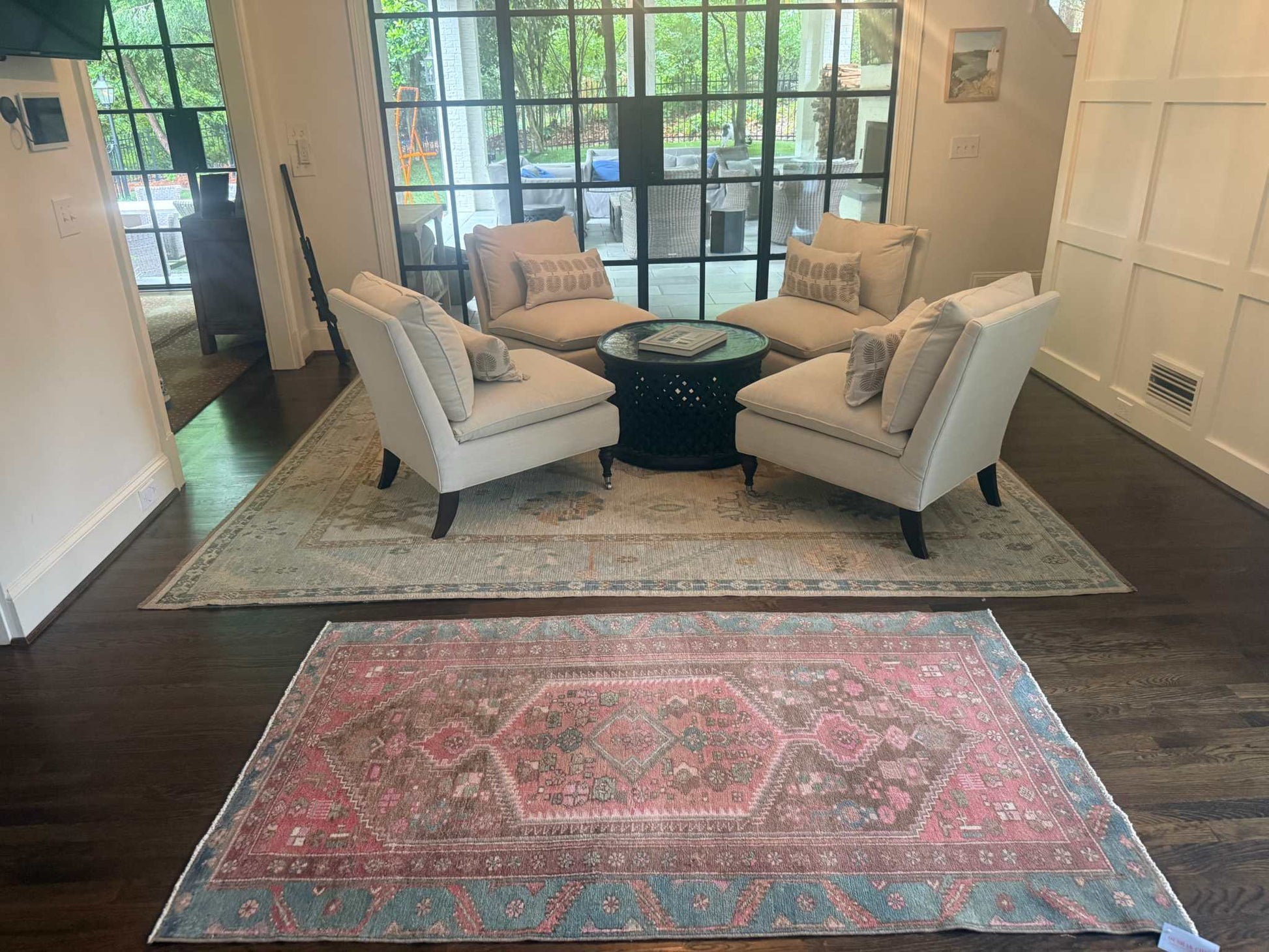 3’9”x6’7” colorful Turkish area rug with reds, pinks, blues, brown, and cream accents