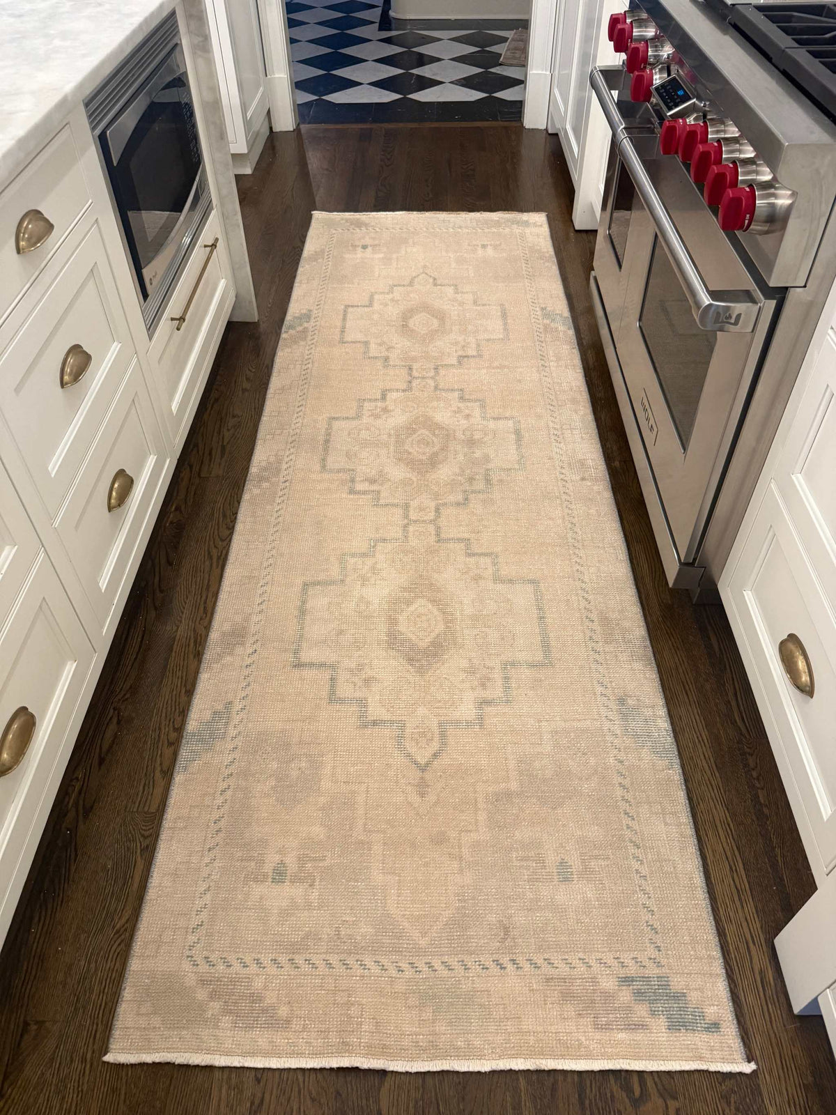 2’11” x 9’1” Runner, neutral beige wool rug with a faded geometric pattern and subtle blue accents