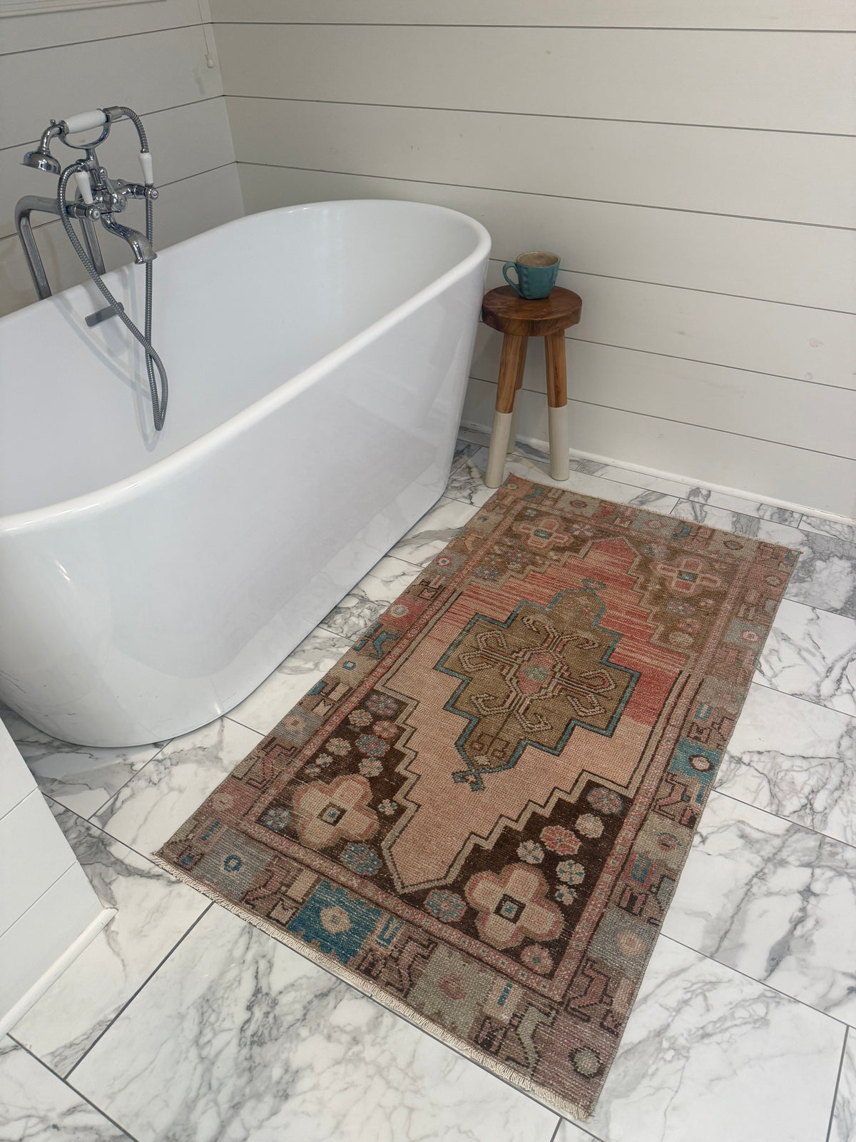 Vintage Rug in muted terracotta and olive-brown wool, with turquoise accents and geometric medallion pattern