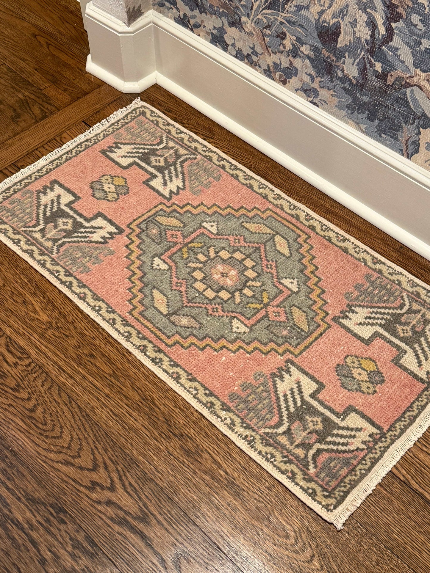 small rug with pink and blue