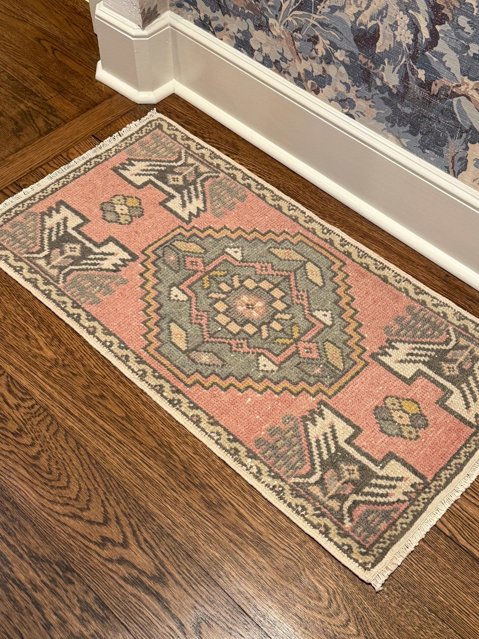 small rug with pink and blue