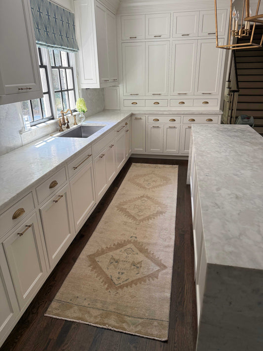 2’10” x 10’10” neutral runner rug with accent colors in a kitchen setting