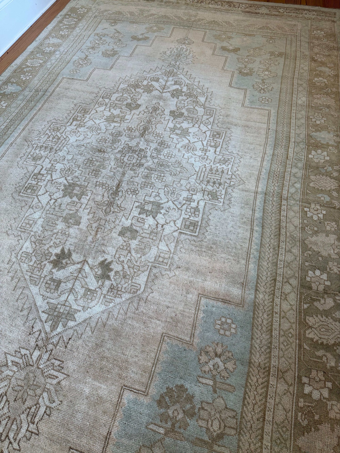 Close-up of a patterned rug with intricate designs.