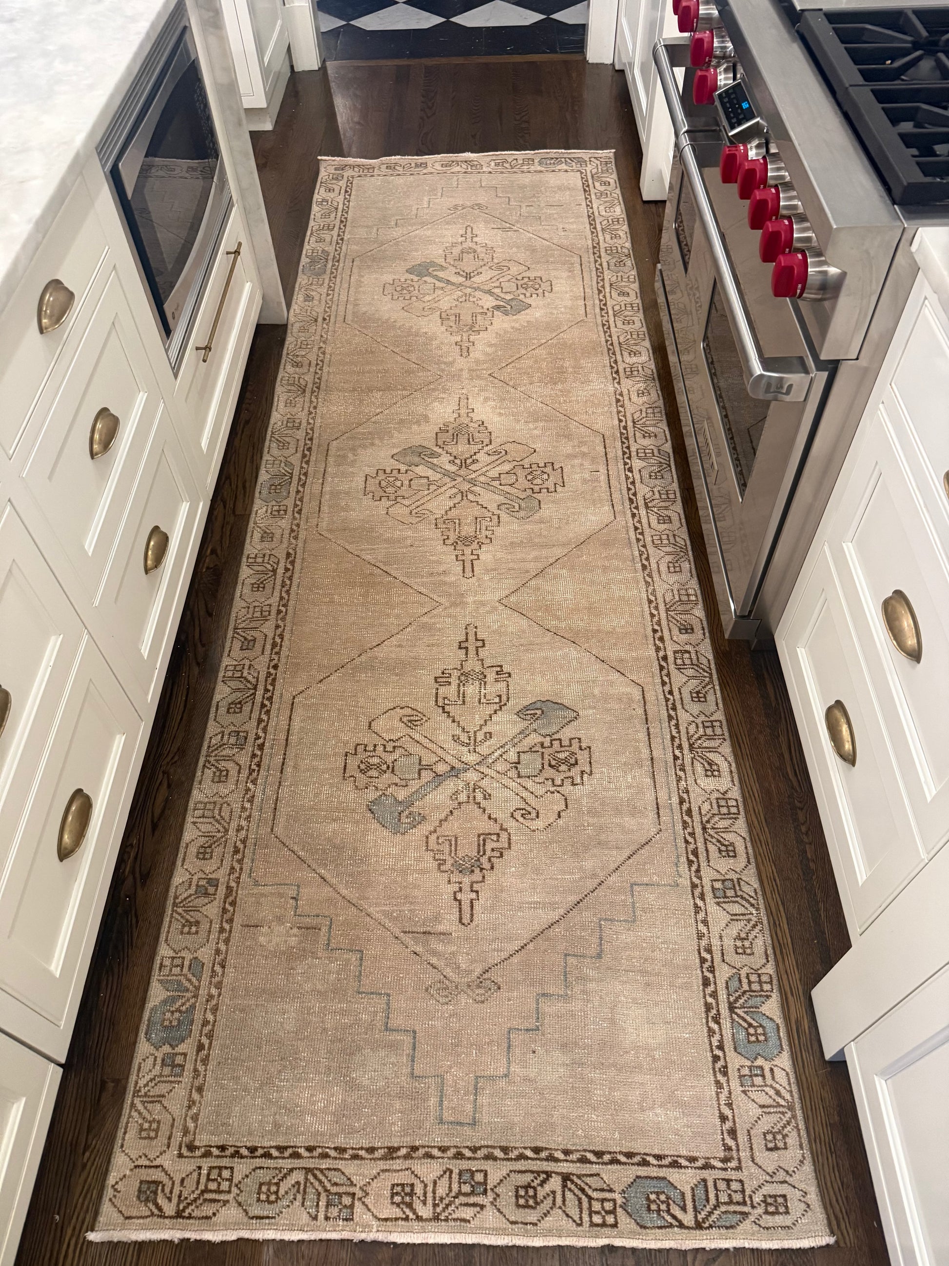 3’4” x 10’3” Runner beige wool rug with faded geometric medallion and ornate patterned border