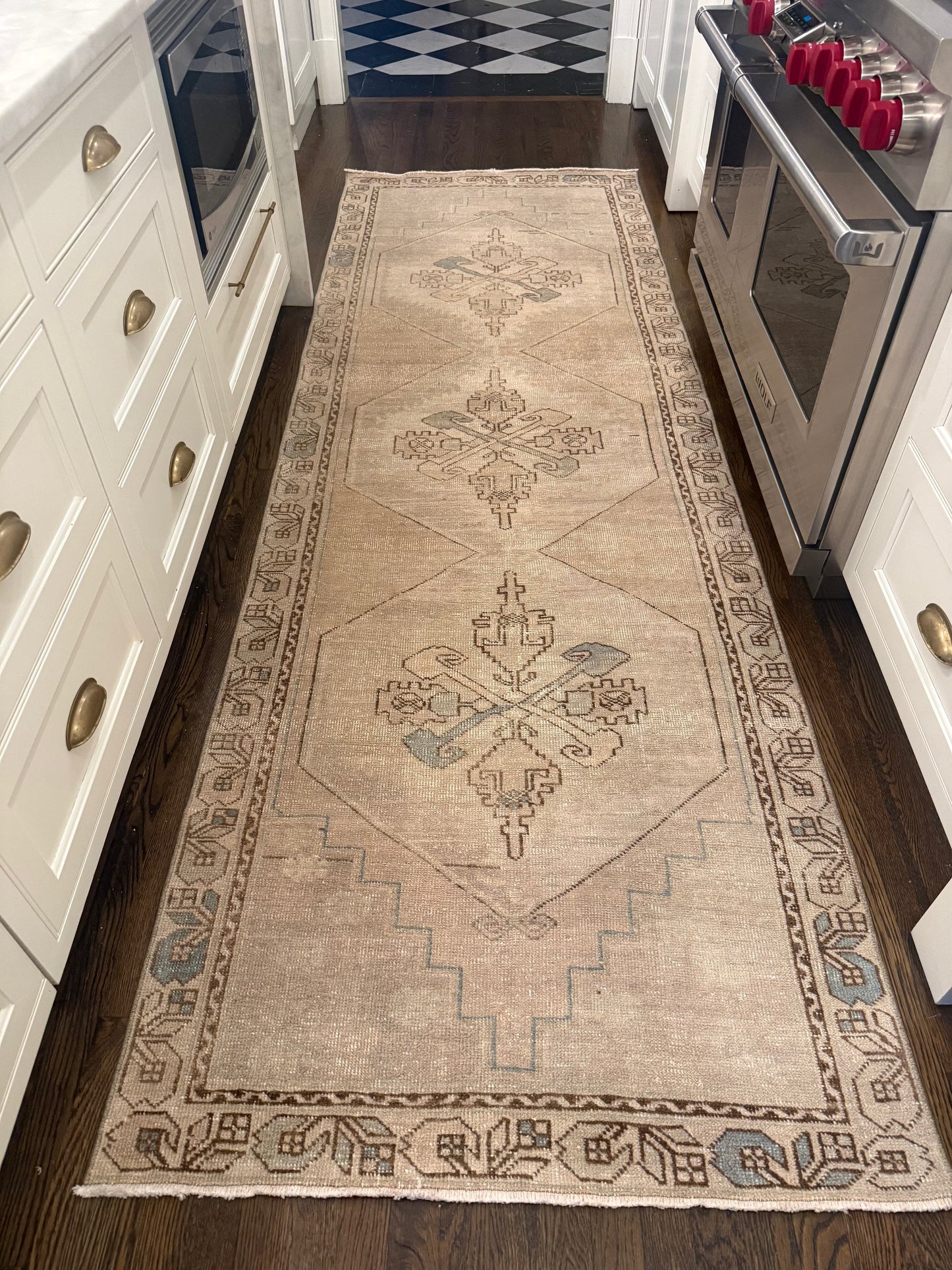 3’4” x 10’3” Runner beige vintage wool rug with faded geometric motifs and decorative border