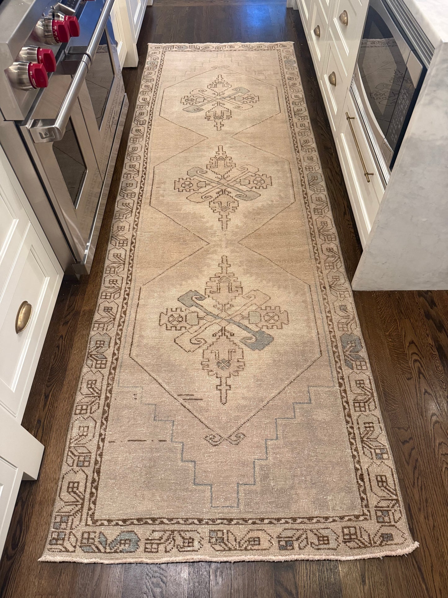 3’4” x 10’3” Runner, beige vintage wool rug with distressed geometric and medallion patterns