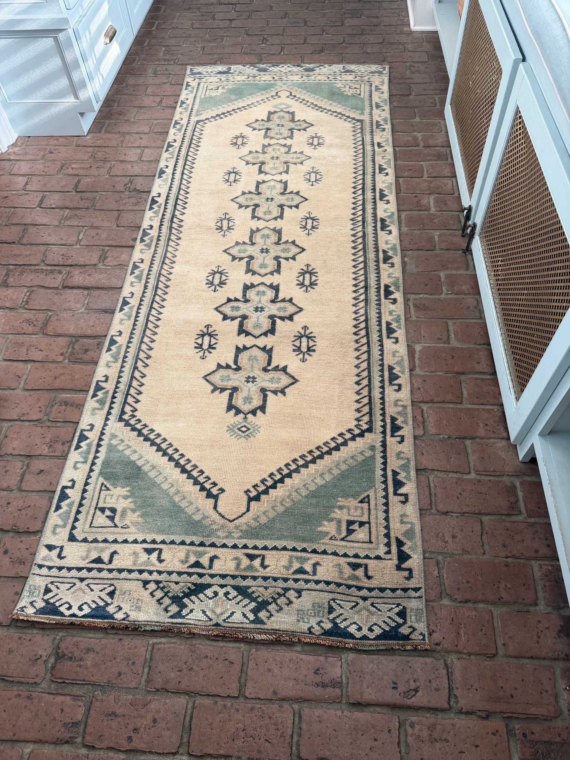 2'11" x 8'5" vintage hand-knotted runner with blue-green and beige cross center design