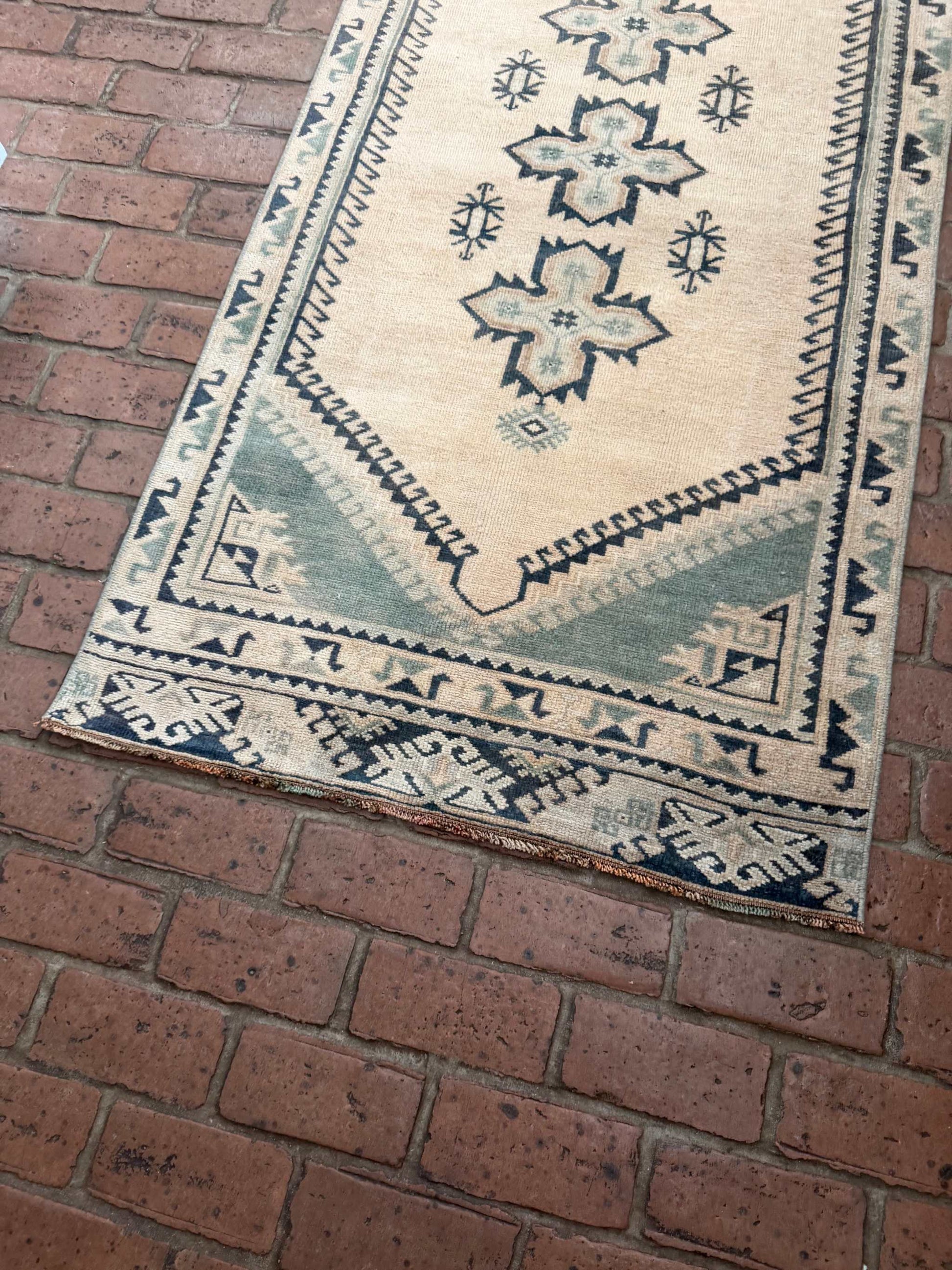 2'11" x 8'5" hand-knotted vintage runner with blue-green and beige cross center design