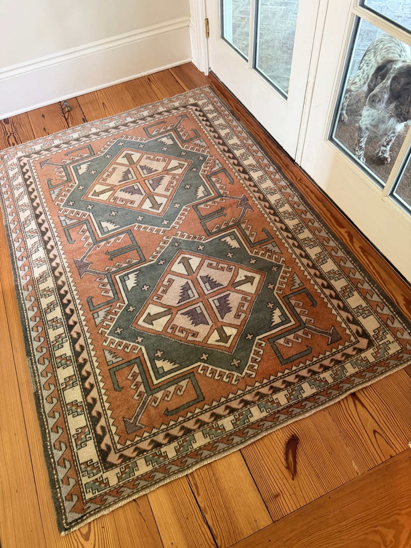 4' x 5'10" area rug with rust and gray double medallion design