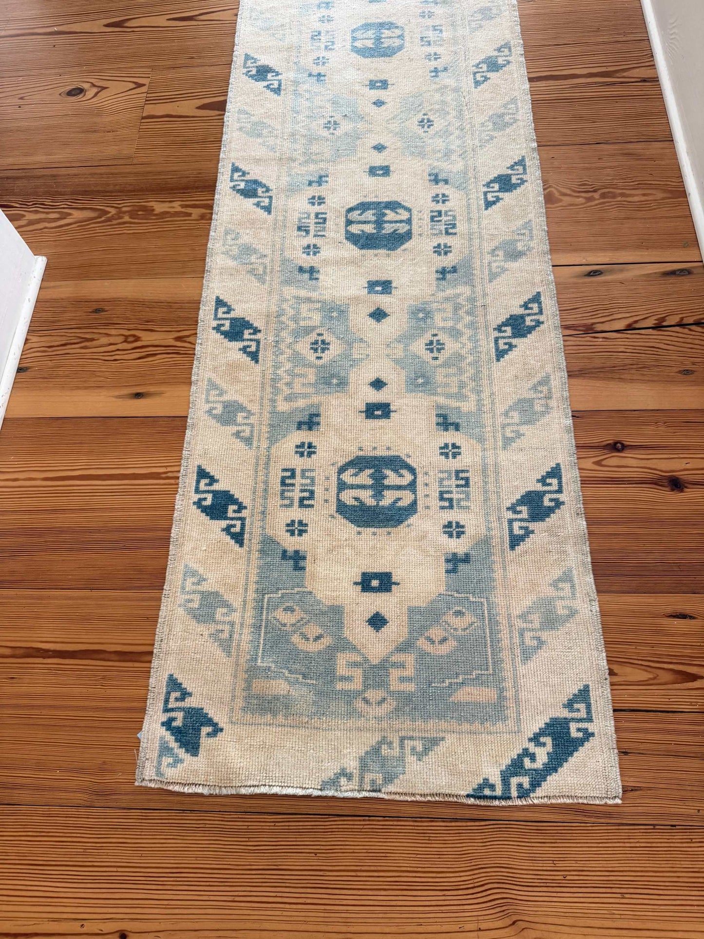 2' x 9'3" narrow runner with rich blues and creamy ivory vintage design