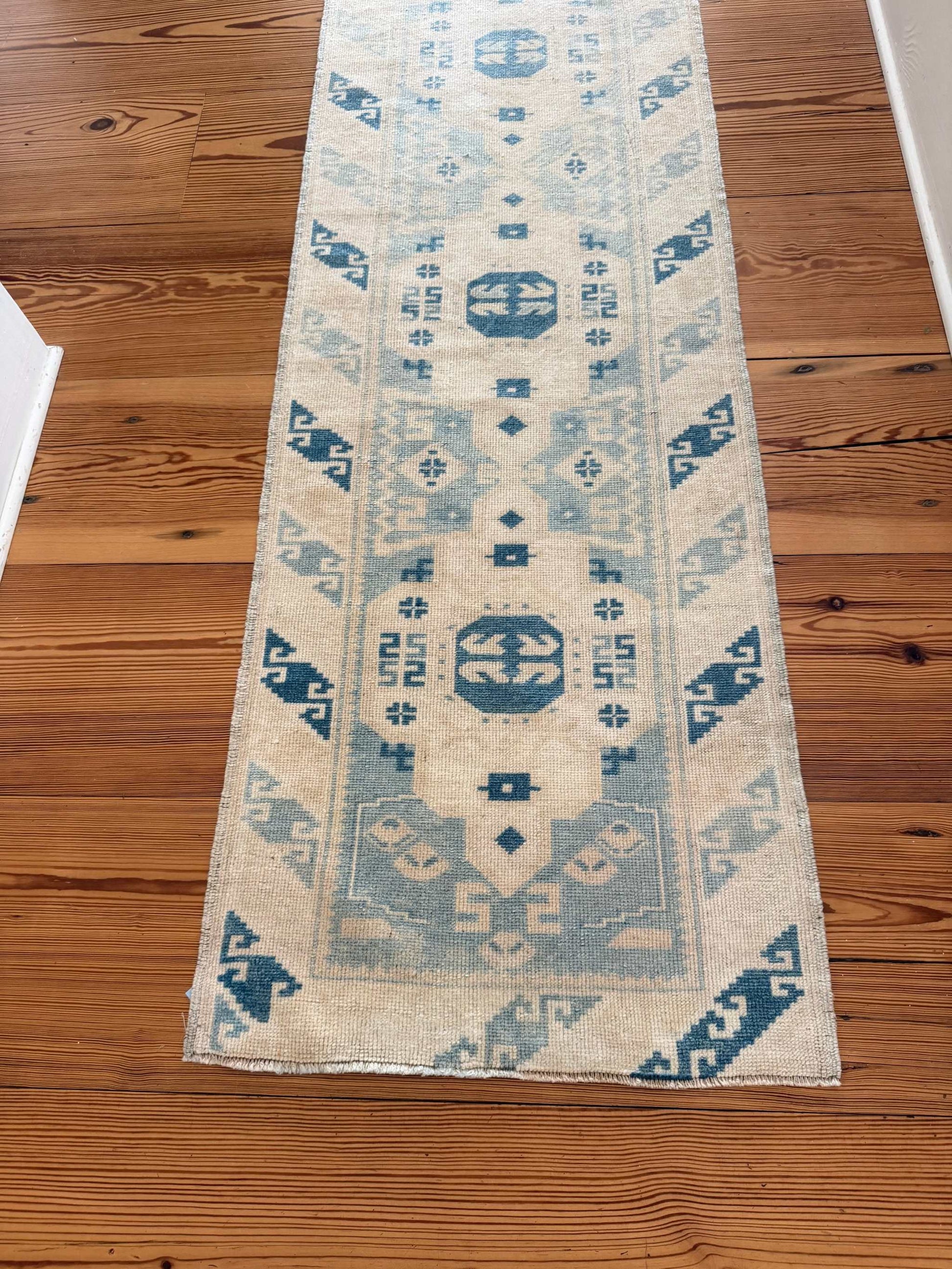 2' x 9'3" narrow runner with rich blues and creamy ivory vintage design