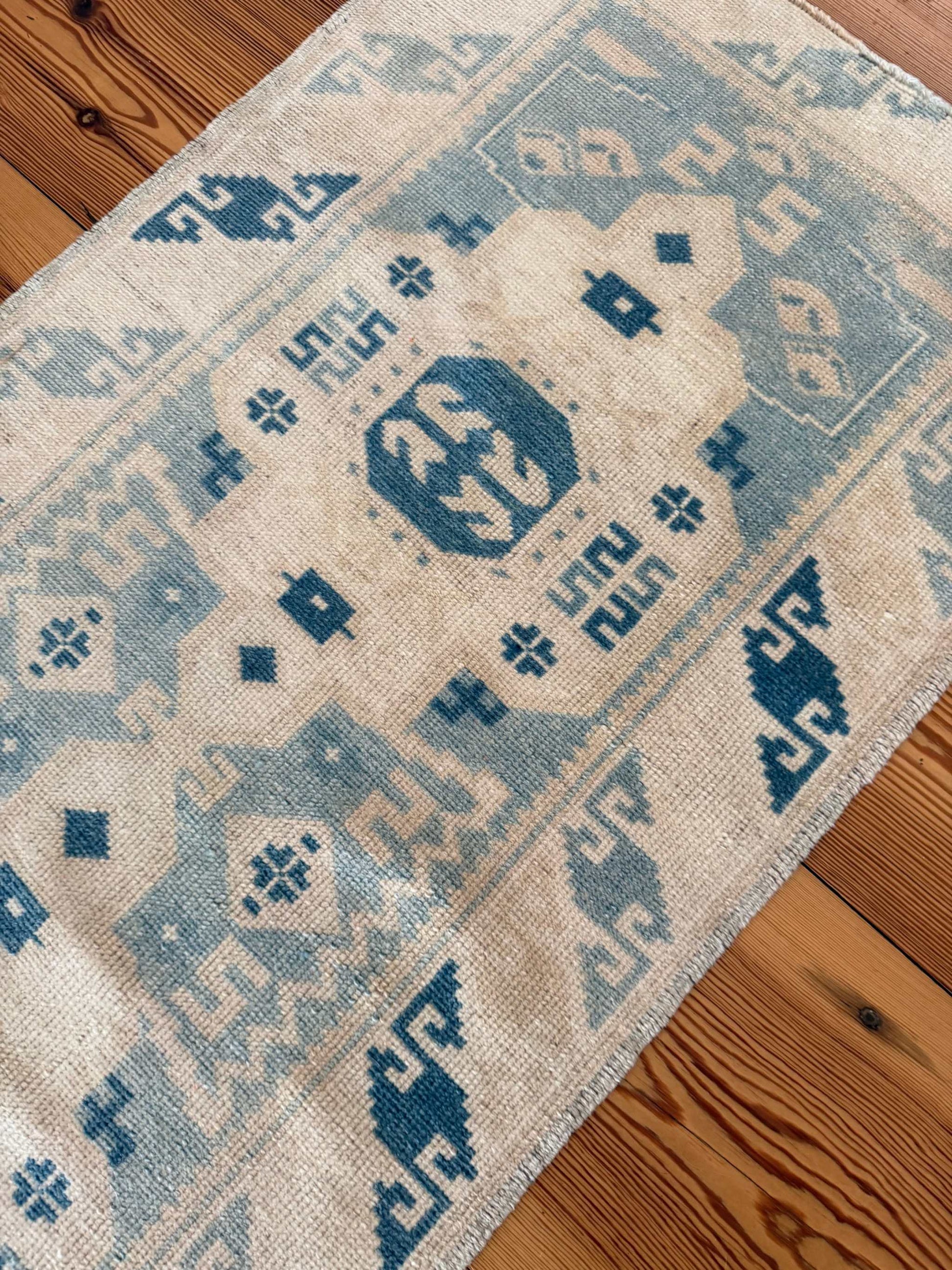 2' x 9'3" narrow runner with hand-knotted vintage blues and ivory tones