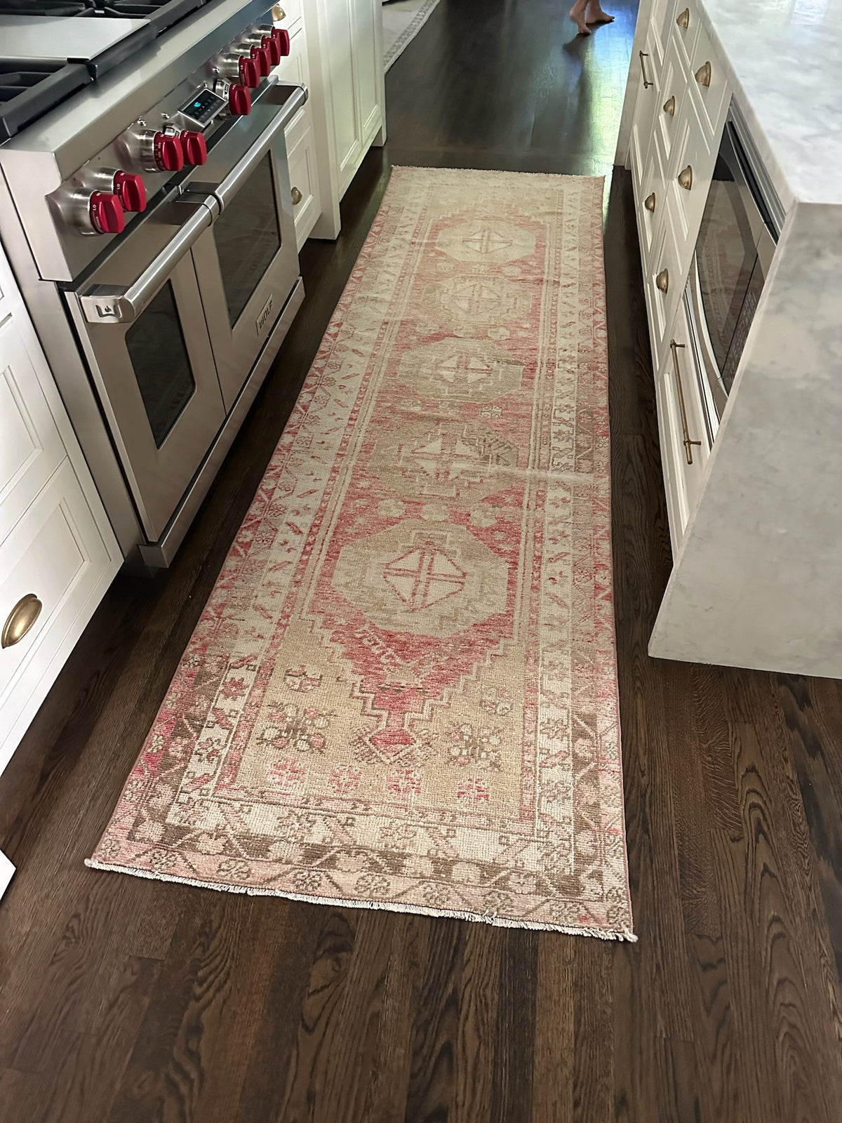 red rug runner in a kitchen 