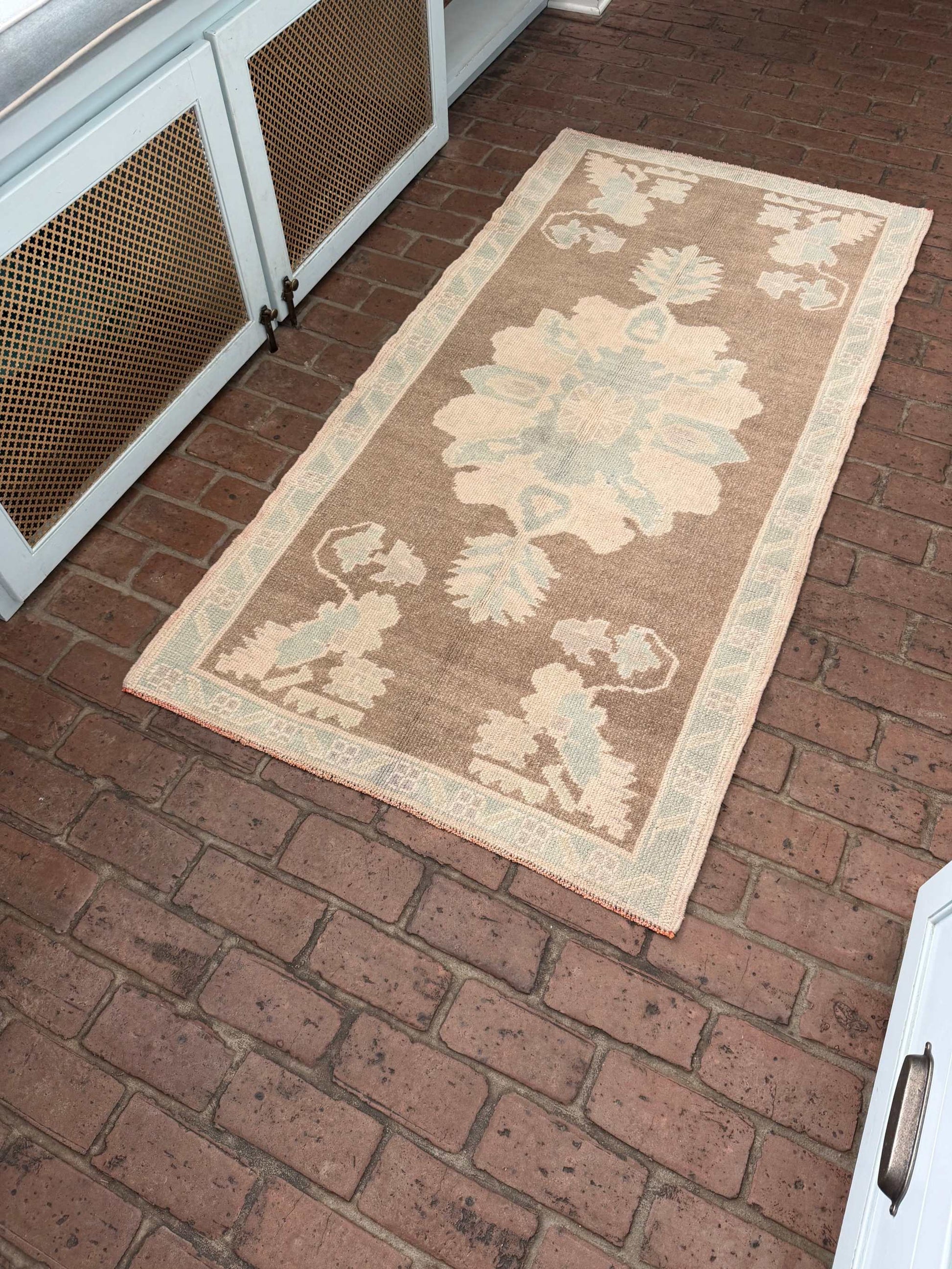 3'1" x 6'1" hand knotted runner rug with brown background and blue taupe designs