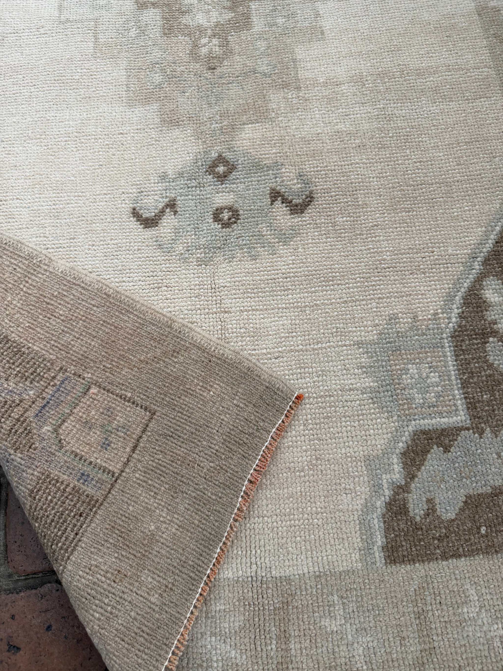 Hand knotted Turkish rug 2'11" x 6'5" with taupe, brown, and blue center medallion design