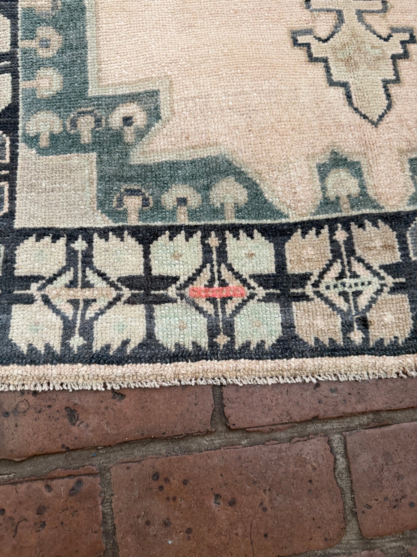 3'4" x 6'5" hand knotted area rug with blues, greens, taupe, classic medallion, and unique hot pink spot