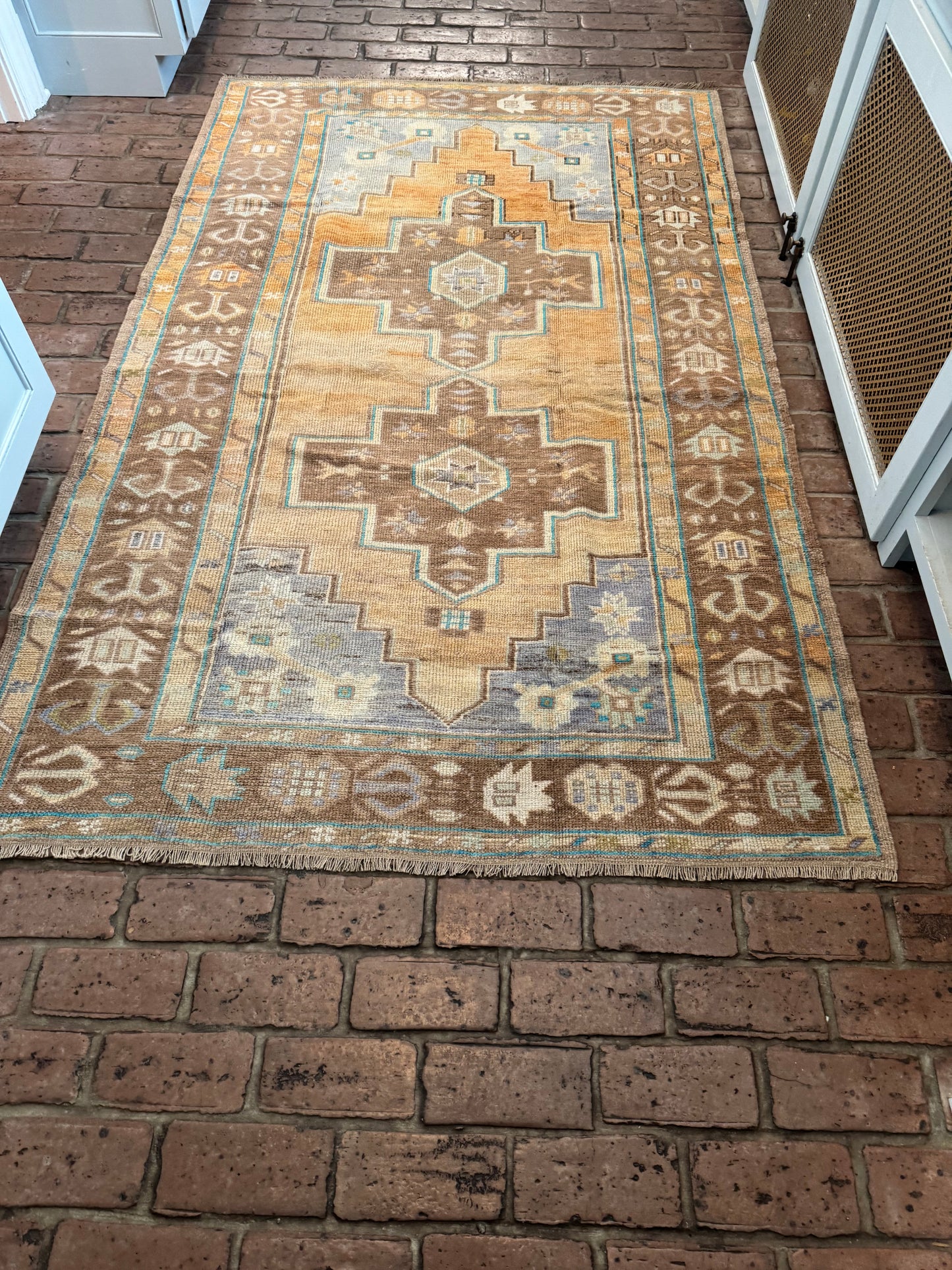 4'4" x 7'1" Area Rug with Orange and Brown