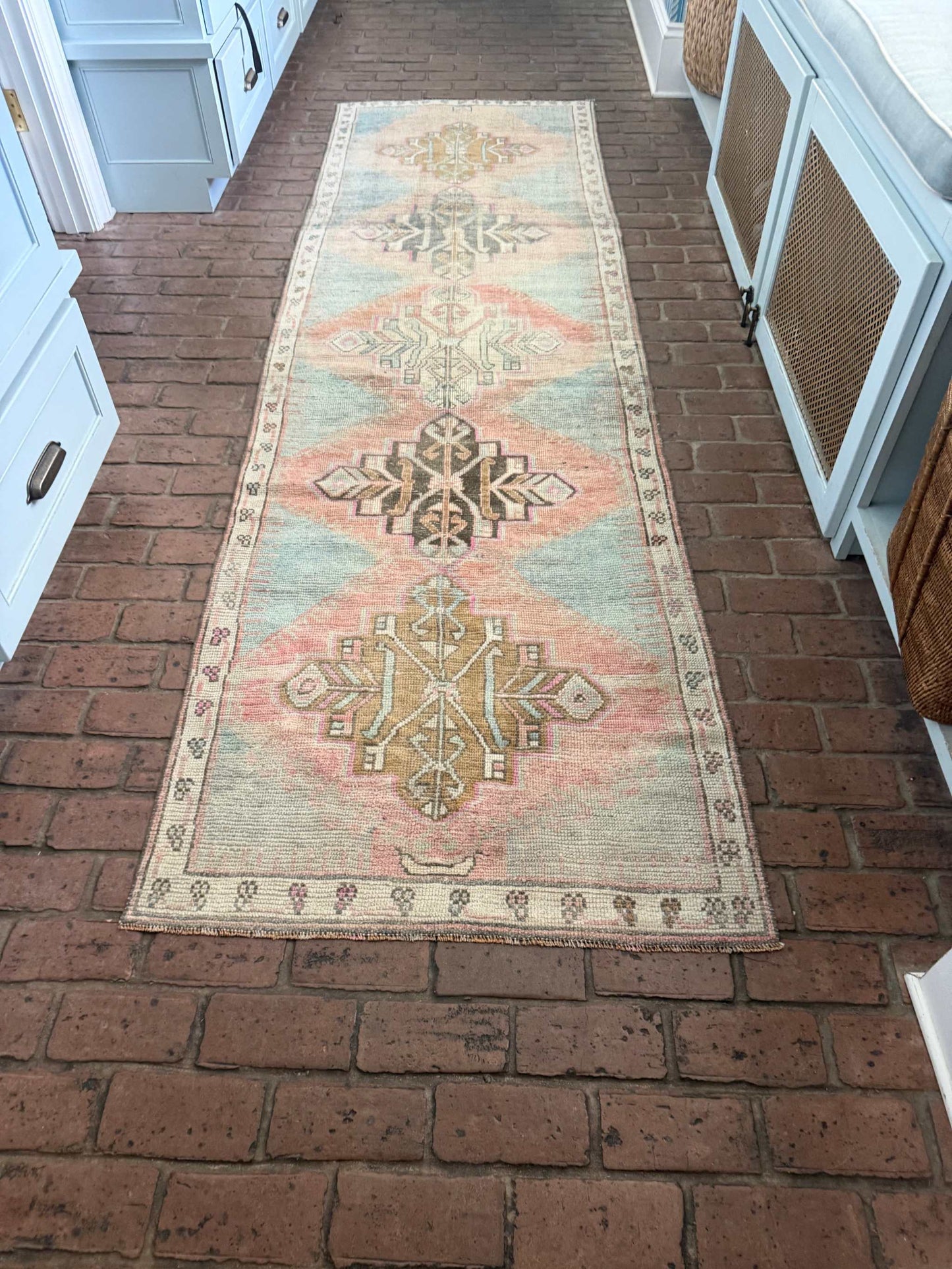 3'1" x 10'6" hand-knotted Turkish rug runner with blues, blush, pinks, and browns