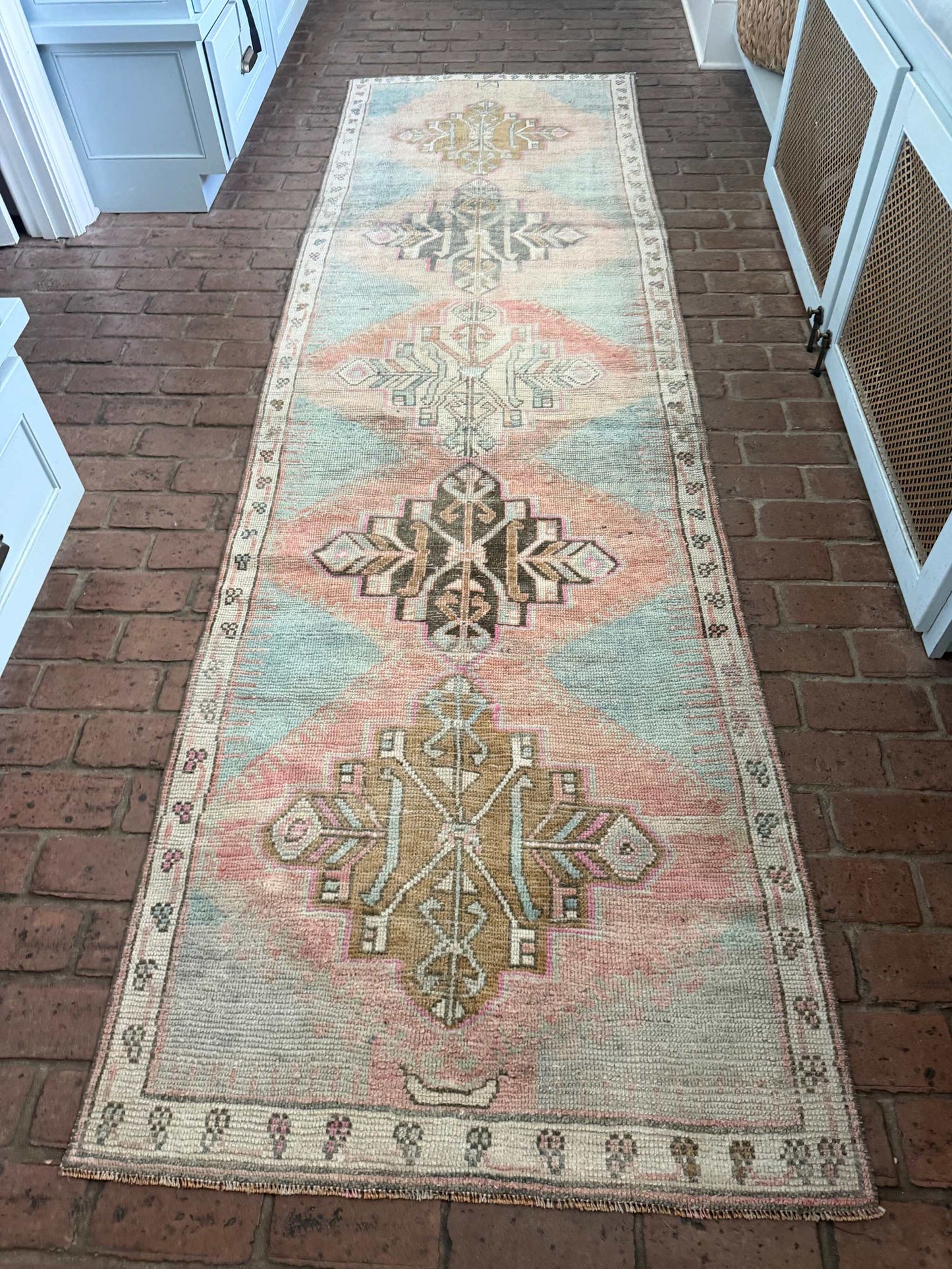 3'1" x 10'6" hand-knotted Turkish rug runner with blues, blush, pinks, and browns