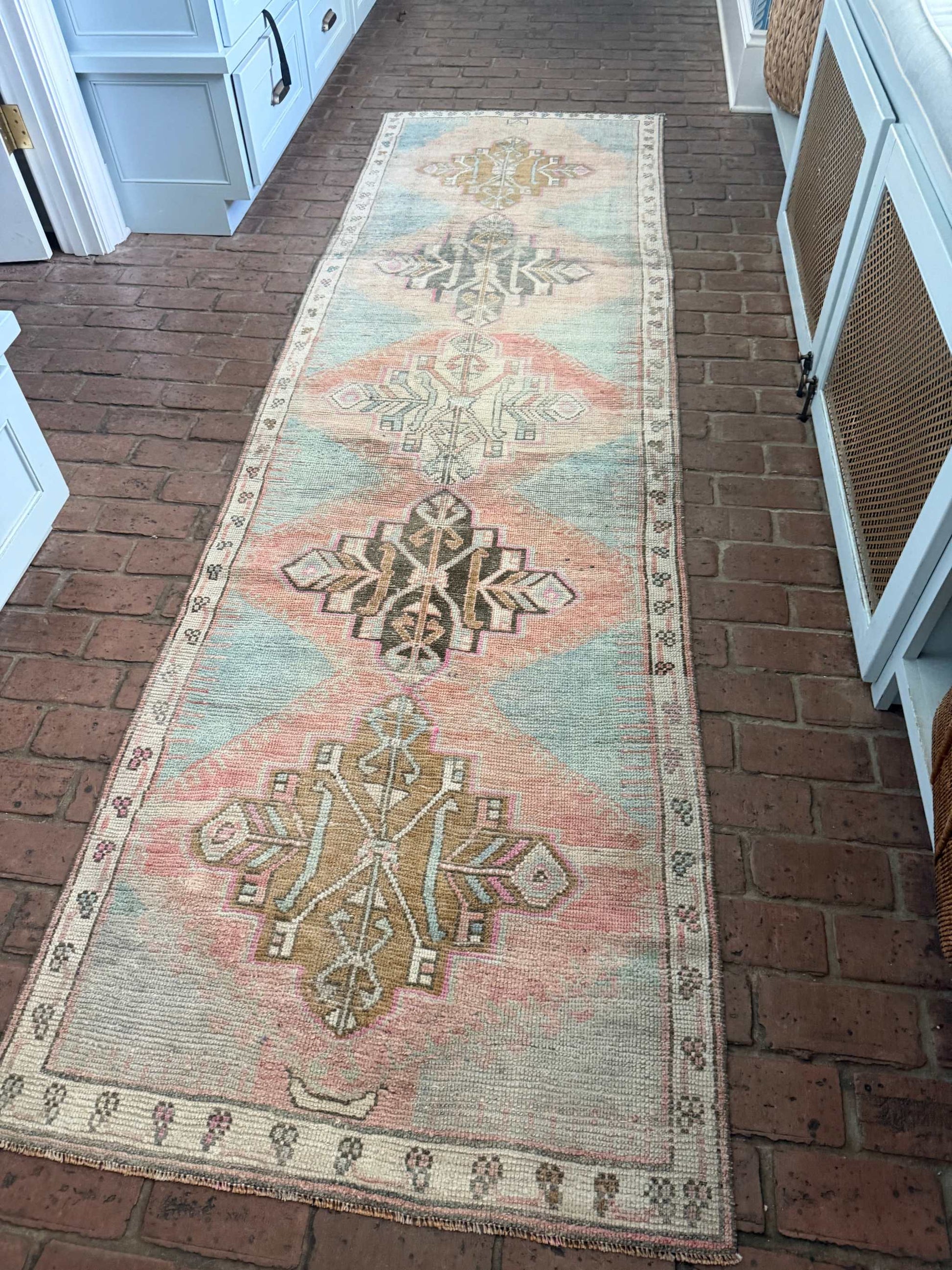 3'1" x 10'6" Turkish rug runner with blues, blush, pinks, and browns