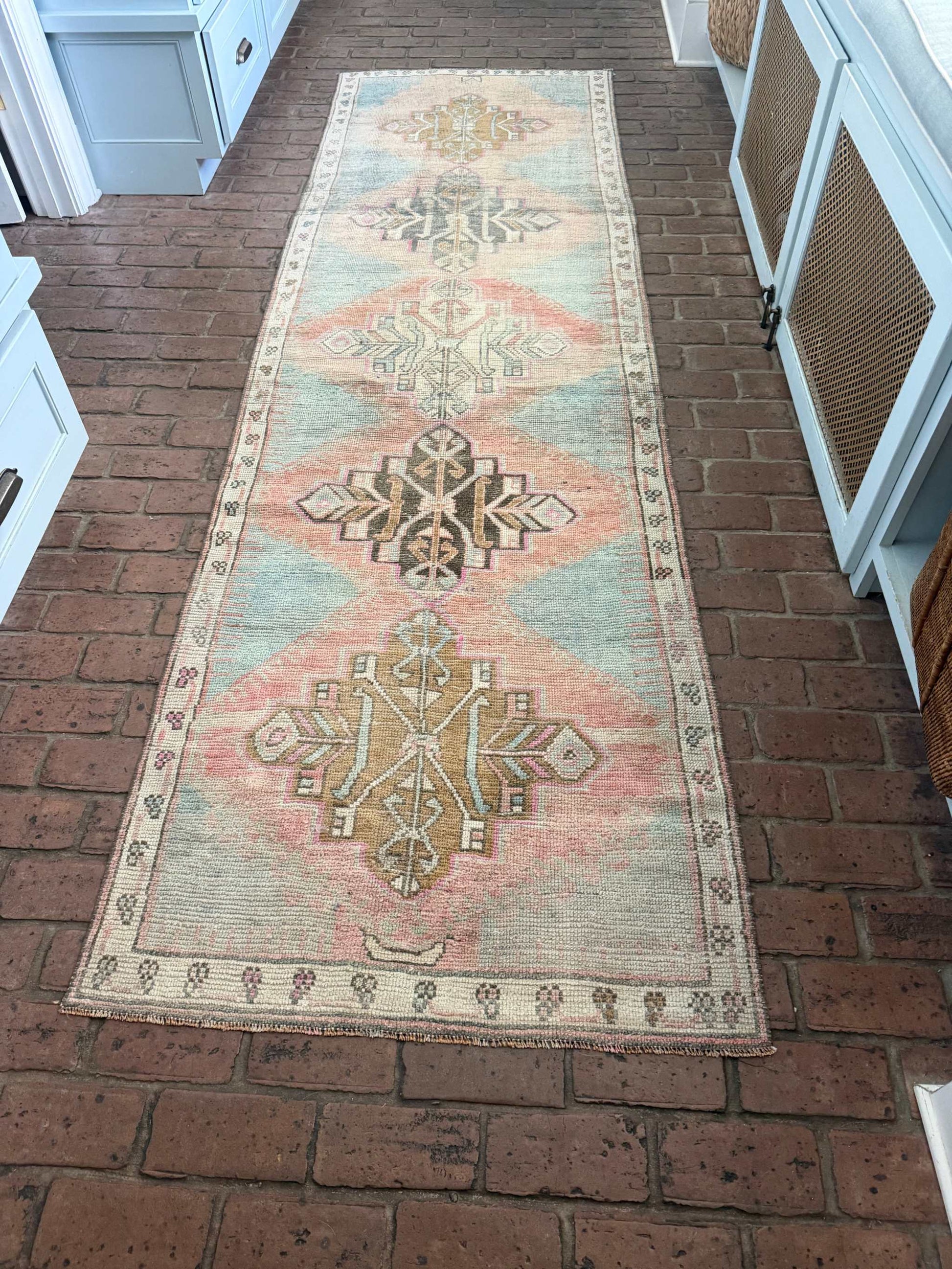 3'1" x 10'6" Turkish hand-knotted rug runner in blues, blush, pinks, and browns