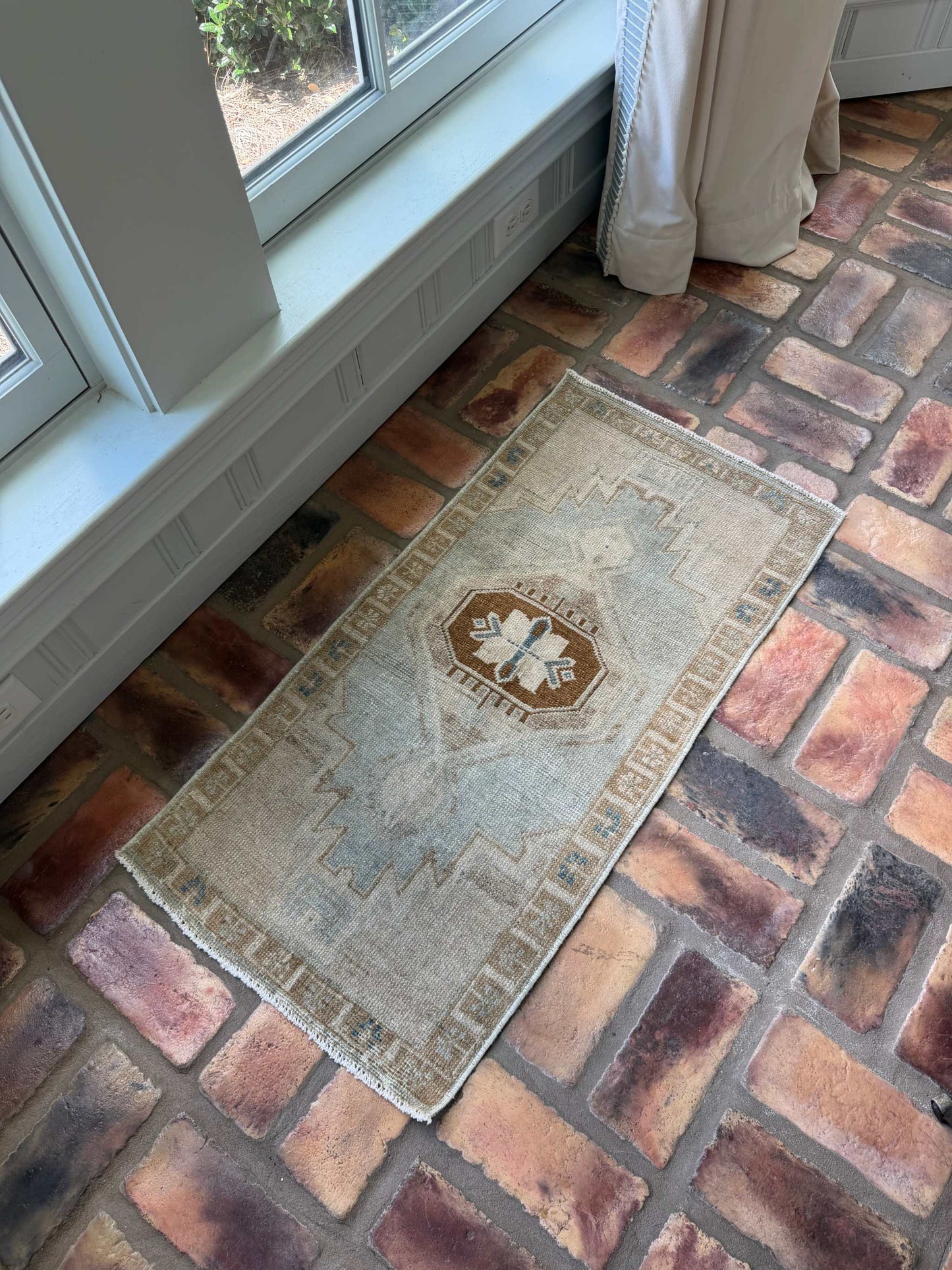 Small vintage Oushak mat with pale blue-gray, beige, and brown hand-knotted wool design