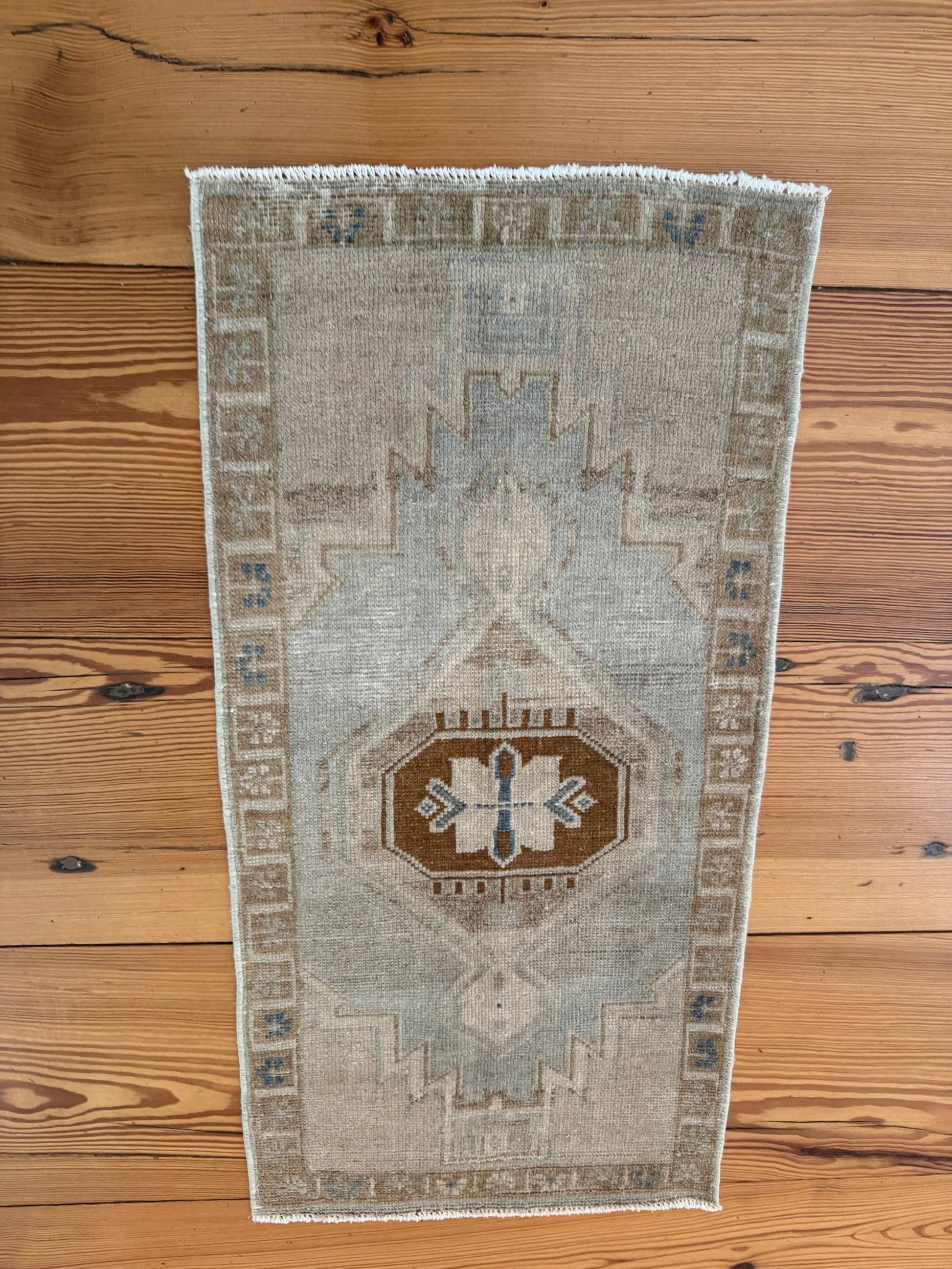 Small vintage Oushak mat with pale blue-gray, beige, and brown hand-knotted wool design