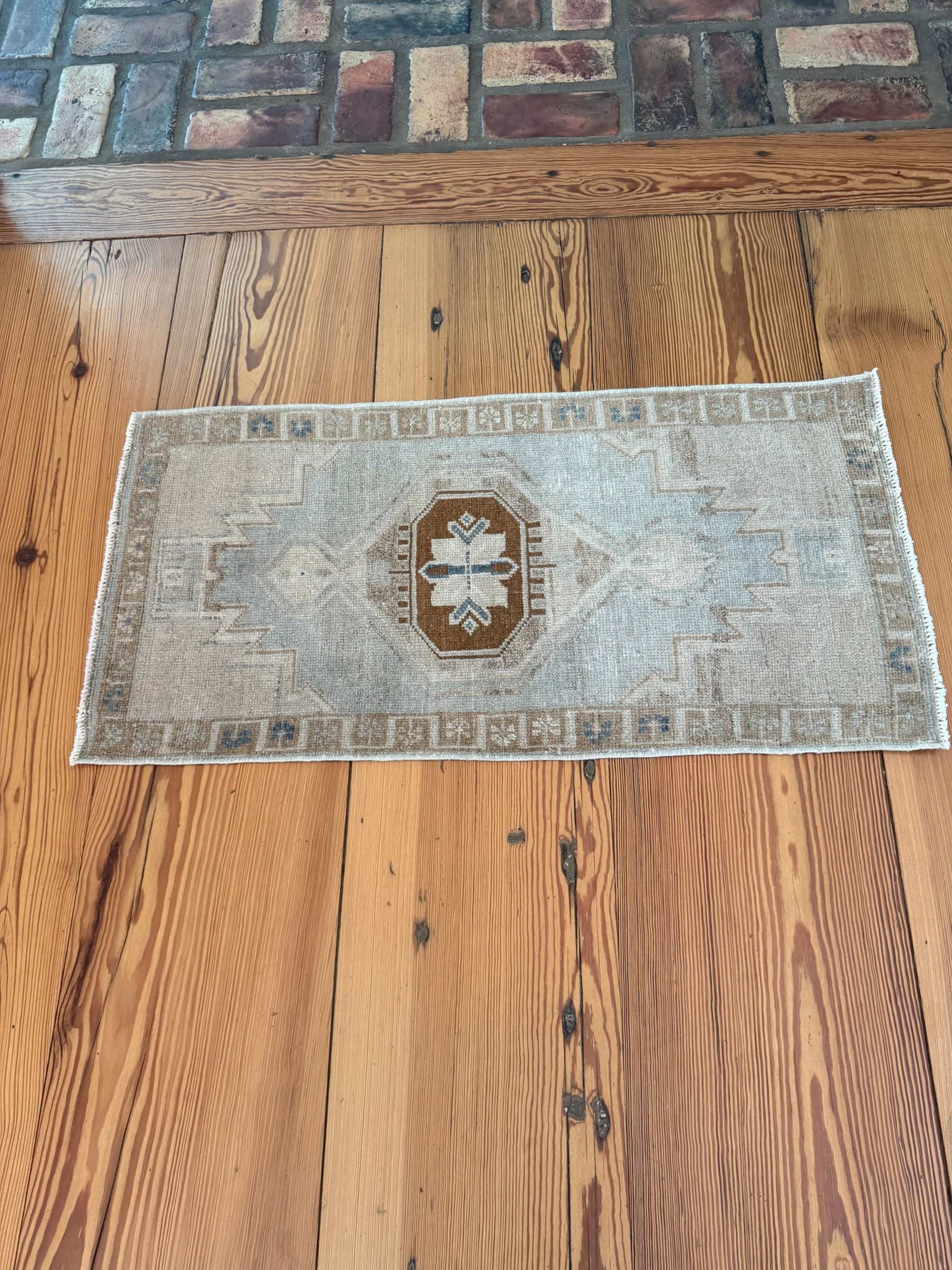 Small vintage Oushak mat in pale blue-gray, beige, and brown hand-knotted wool