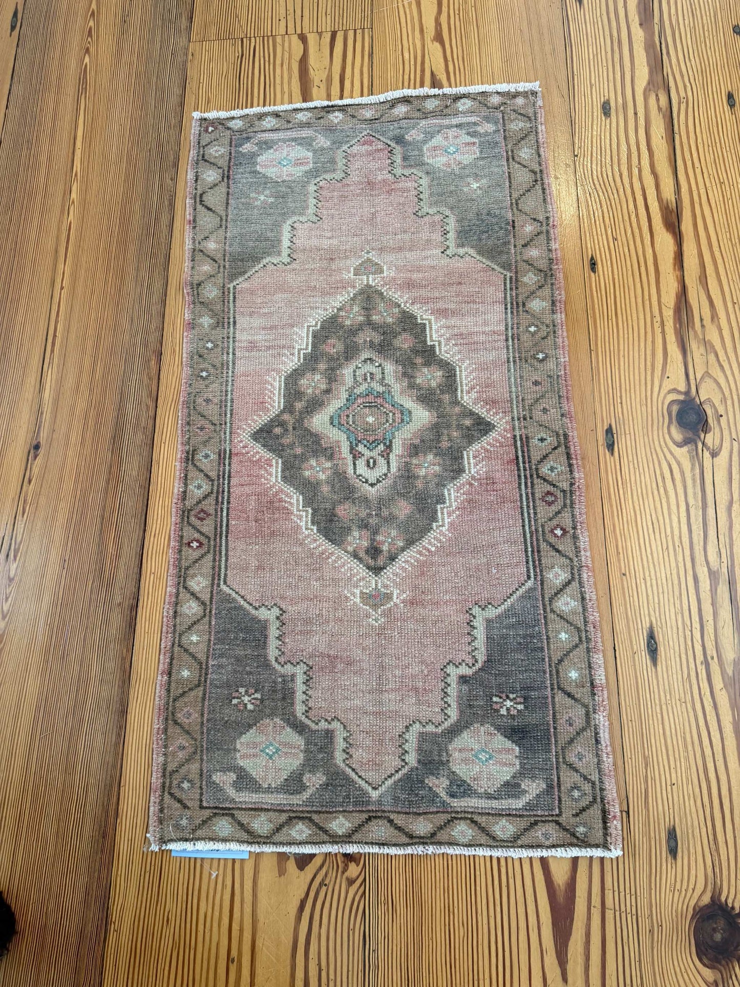 Small 1'9" x 3'4" vintage Turkish mat with brick red and brown hand-knotted wool design