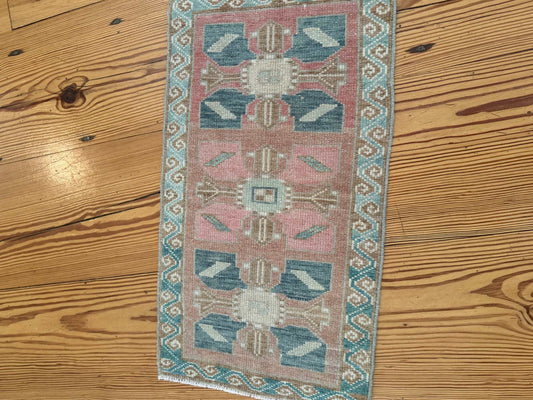 Small vintage Turkish Mat 1'5.5" x 2'8" hand-knotted wool with blues, pink, and red-brown colors