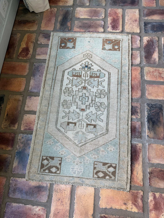1'9" x 3' vintage hand-knotted Oushak rug in pale blue, beige, and brown colors