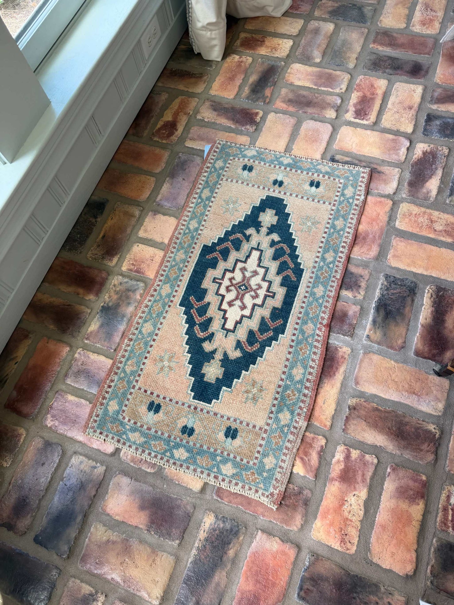 Small Turkish Rug 1'8" x 3'1" with navy, beige, and blue center medallion design, hand-knotted wool vintage Oushak rug